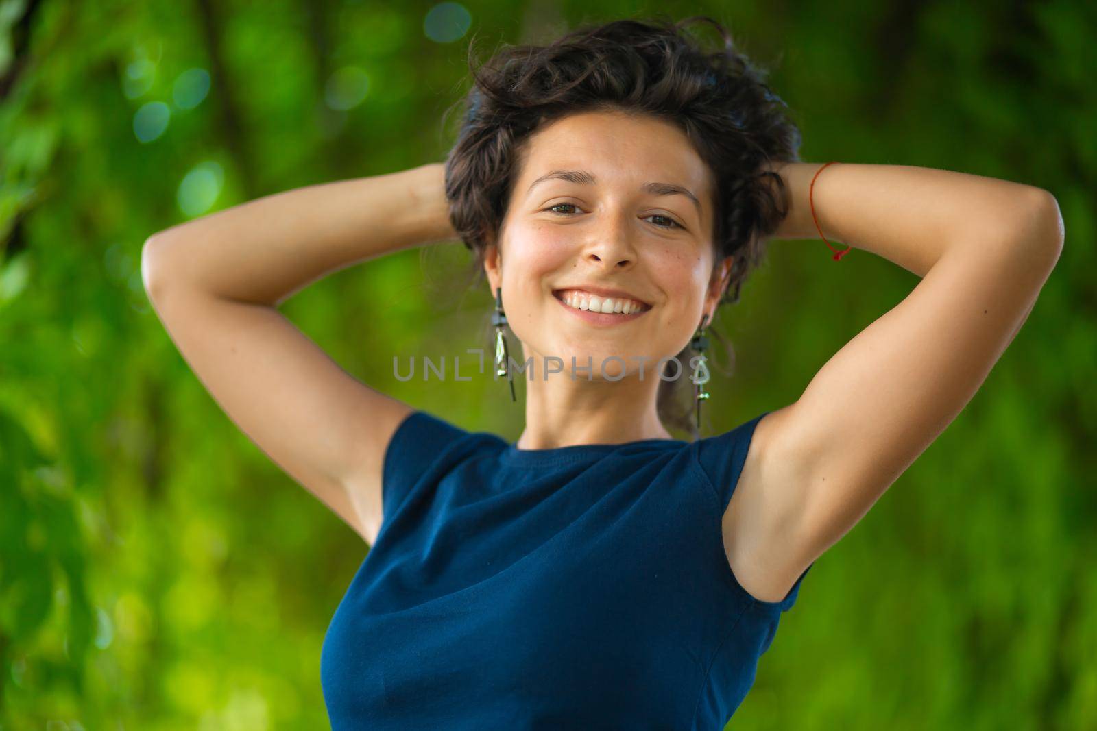 Portrait of young beautiful brunette enjoy walking in green summer park by Try_my_best