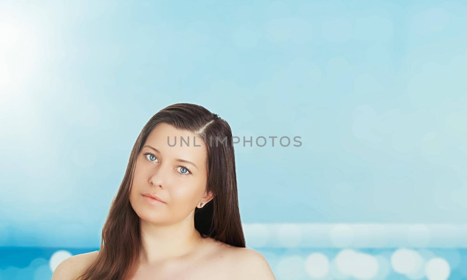 Skincare and sun protection in summer. Portrait of a beautiful young suntanned woman, blue sea and sky on background, beauty, wellness and travel concept by Anneleven