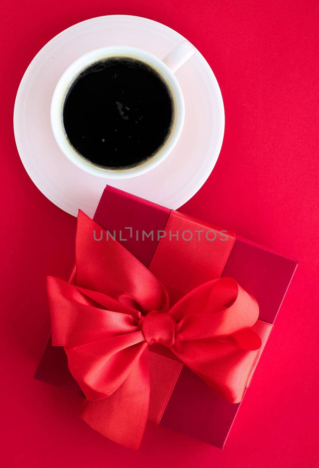 Romantic celebration, lifestyle and birthday present concept - Luxury beauty gift box and coffee on red, flatlay