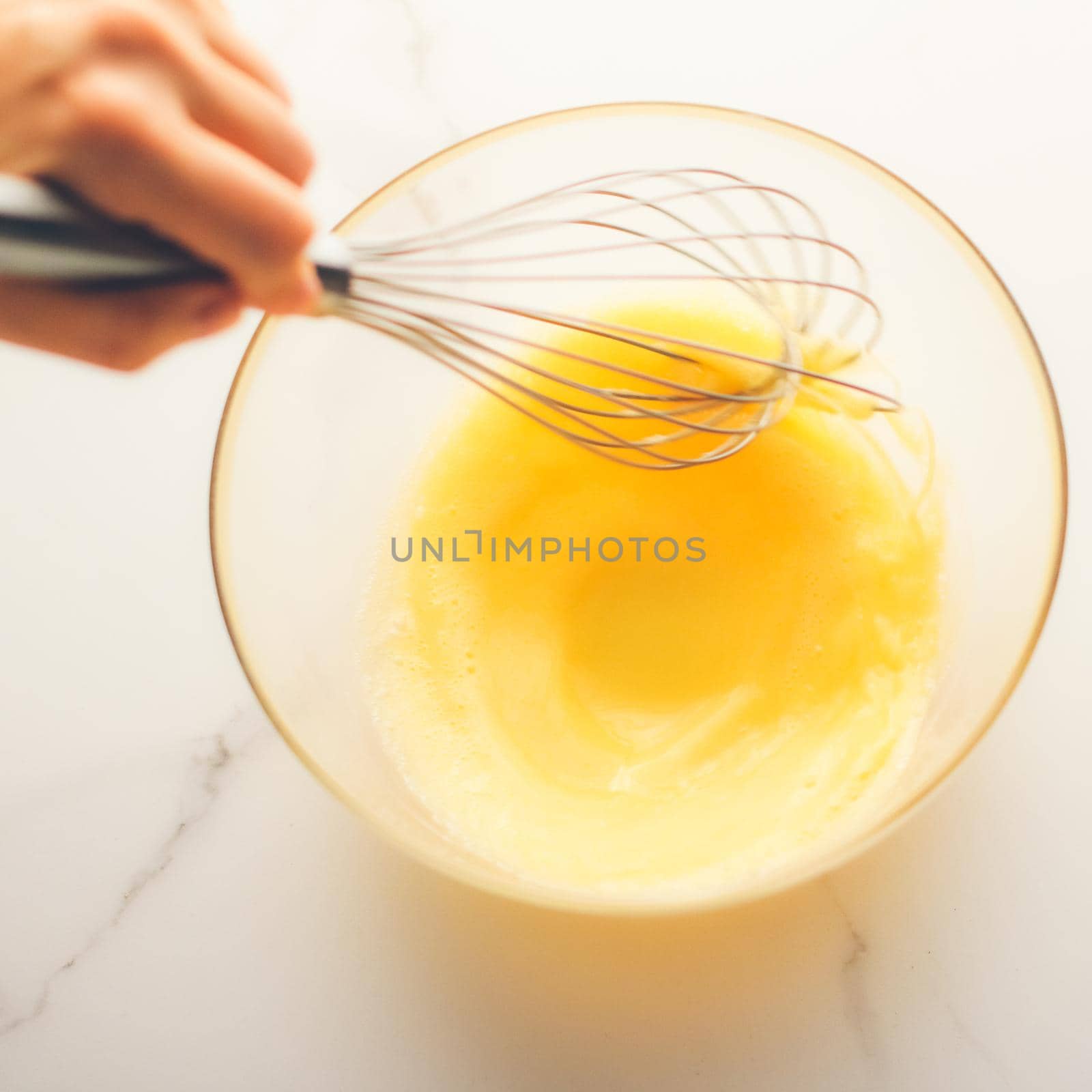 Making of mixing eggs in bowl on marble table as homemade food flat lay, top view food brand photography flatlay and recipe for cooking blog, menu or cookbook design by Anneleven