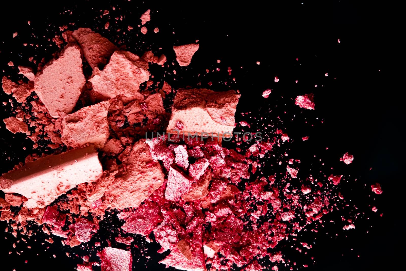 Crushed cosmetics, mineral organic eyeshadow, blush and cosmetic powder isolated on black background, makeup and beauty banner, flatlay design.