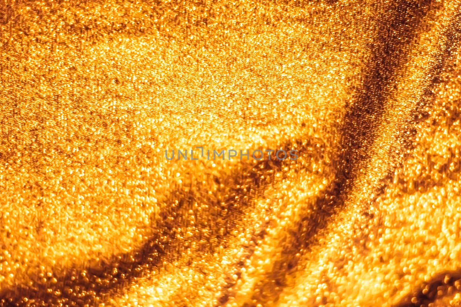 Luxe glowing texture, night club branding and New Years party concept - Golden holiday sparkling glitter abstract background, luxury shiny fabric material for glamour design and festive invitation