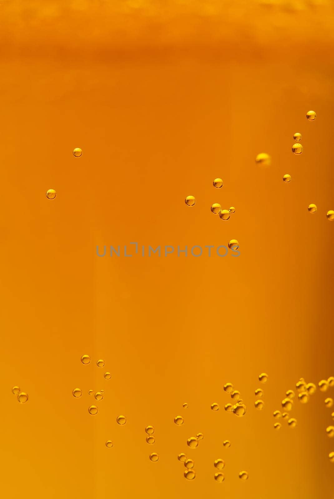 Beer textute can be usedas background. soft focus. Close up of beer with few bubbles and copy space by PhotoTime
