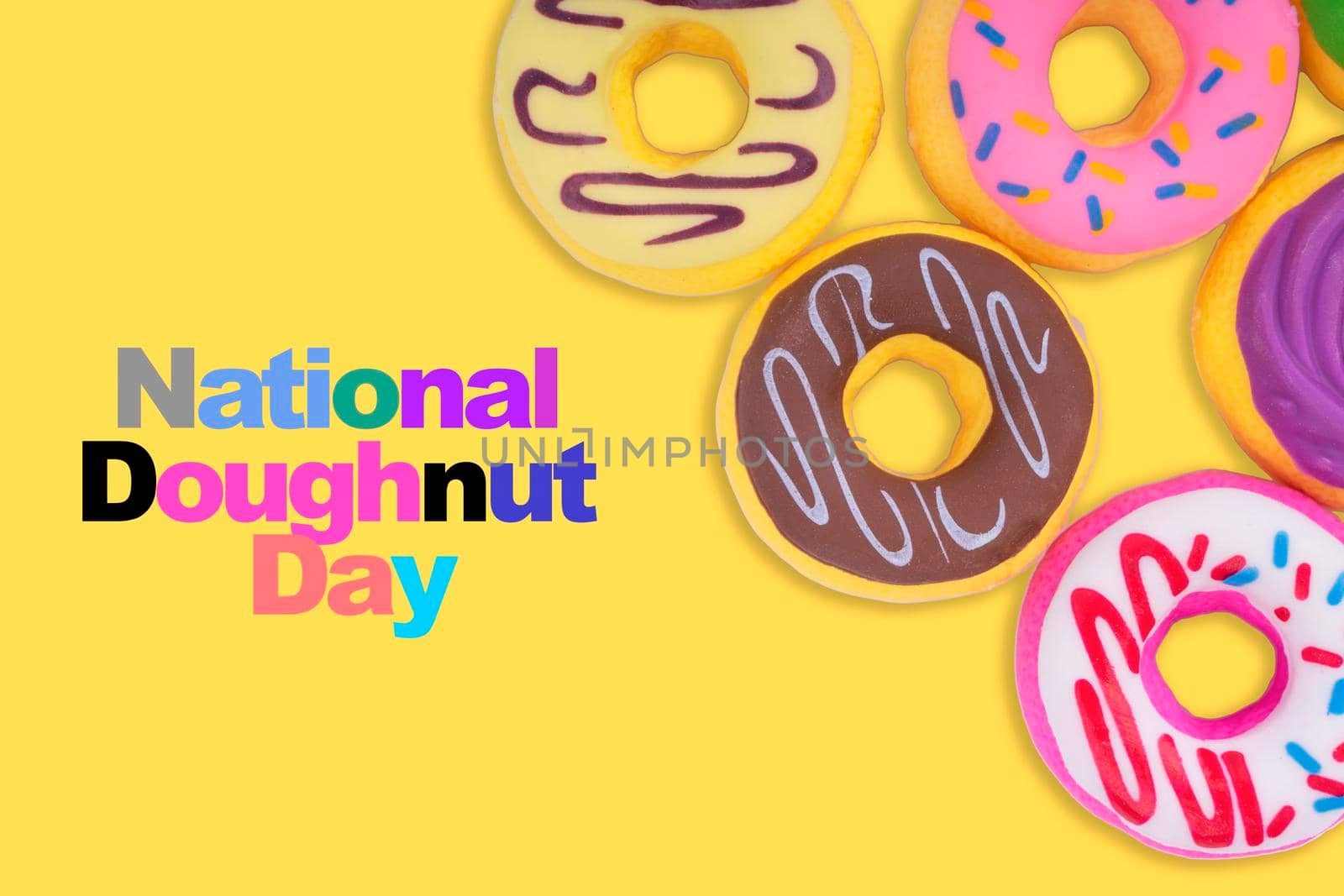 NATIONAL DOUGHNUT DAY text on yellow background by silverwings