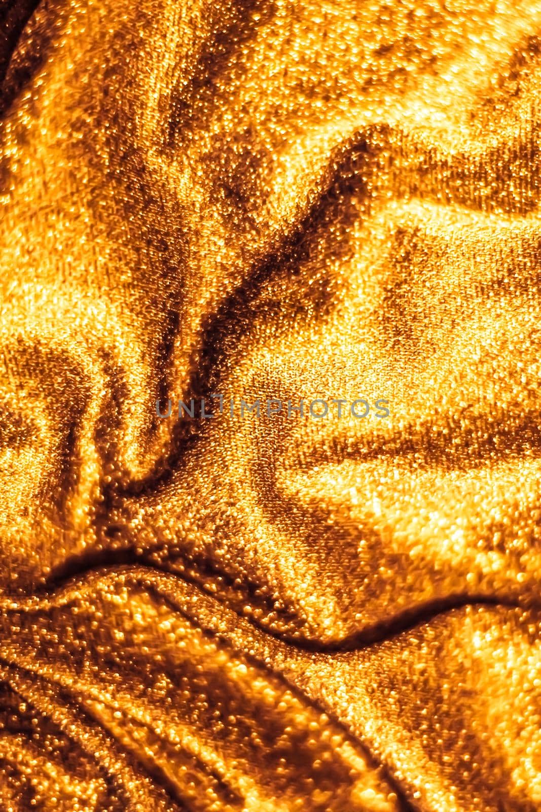 Luxe glowing texture, night club branding and New Years party concept - Golden holiday sparkling glitter abstract background, luxury shiny fabric material for glamour design and festive invitation