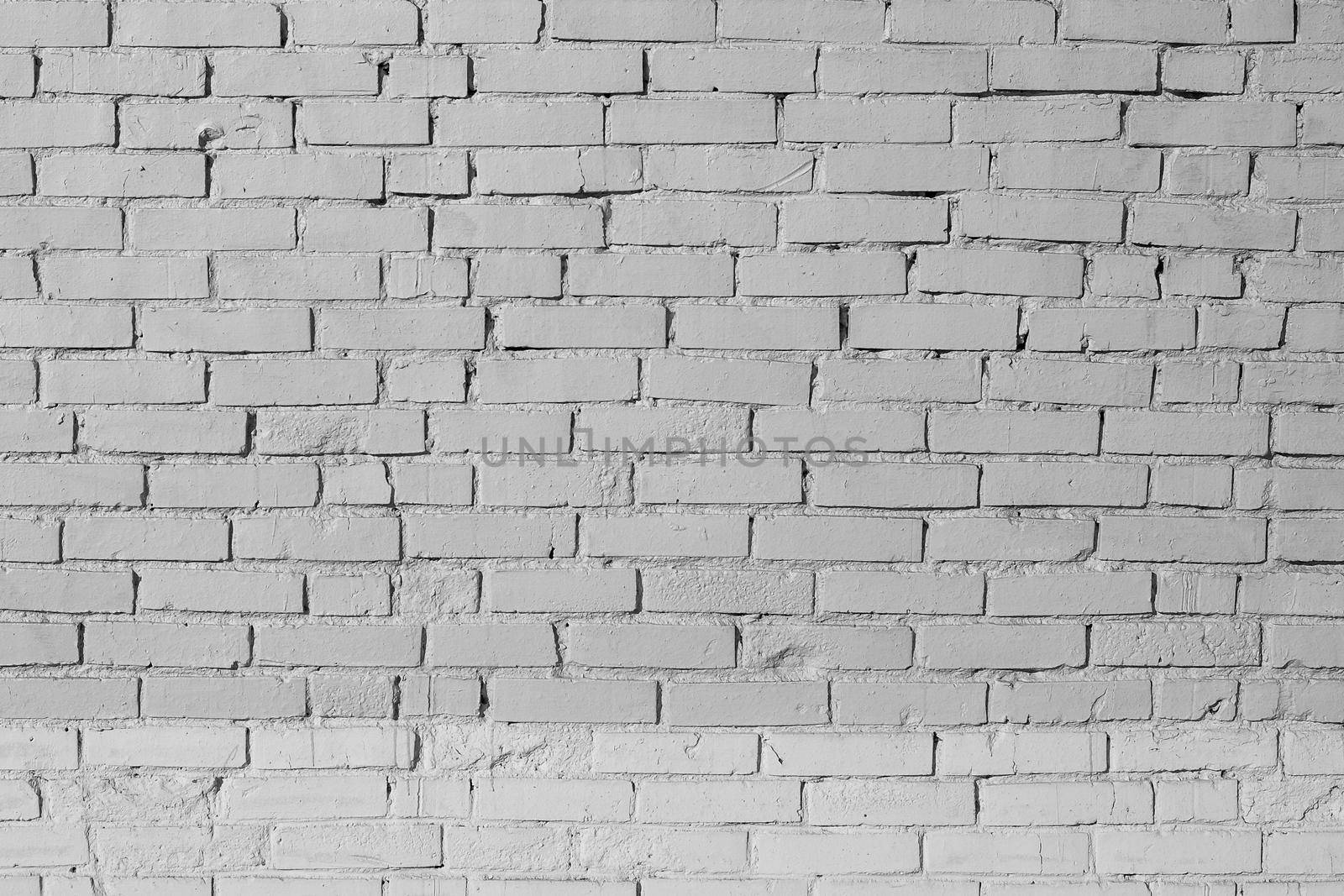 Background of wide white brick wall texture. Old brown brick wall concrete or stone textured, wallpaper limestone abstract wall. Home or office design backdrop.