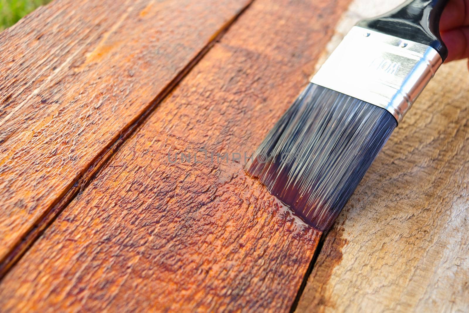 Outdoors Wood Surface Sealant Paintbrush Application Close-up by jjvanginkel