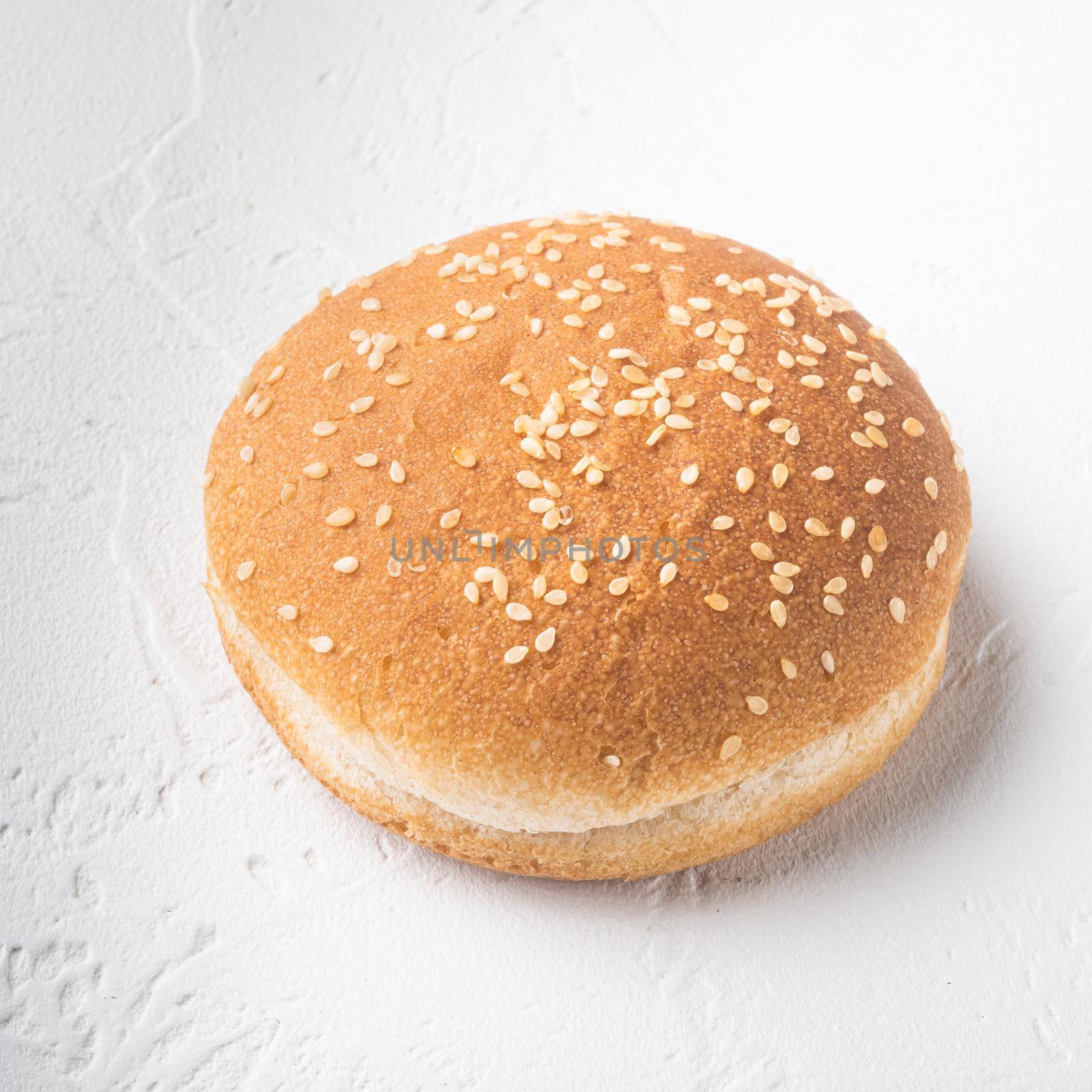 Fresh homemade burger buns with sesame set, square format, on white stone background