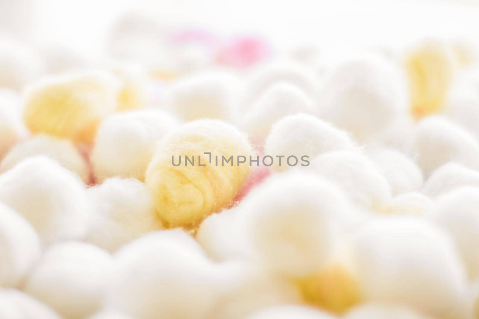 Cosmetology, branding and cleanliness concept - Organic cotton balls background for morning routine, spa cosmetics, hygiene and natural skincare beauty brand product as healthcare and medical design