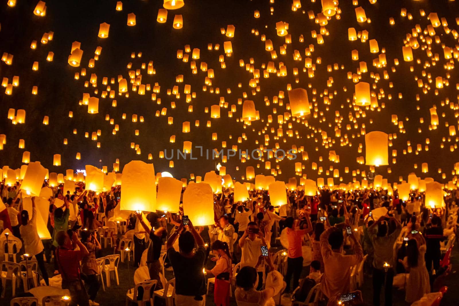 Floating lanterns on sky in Loy Krathong Festival by NuwatPhoto