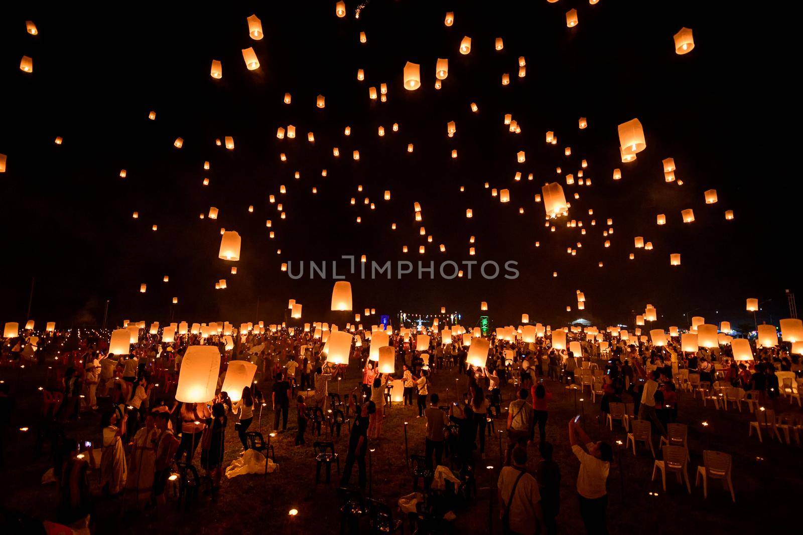 Floating lanterns on sky in Loy Krathong Festival by NuwatPhoto