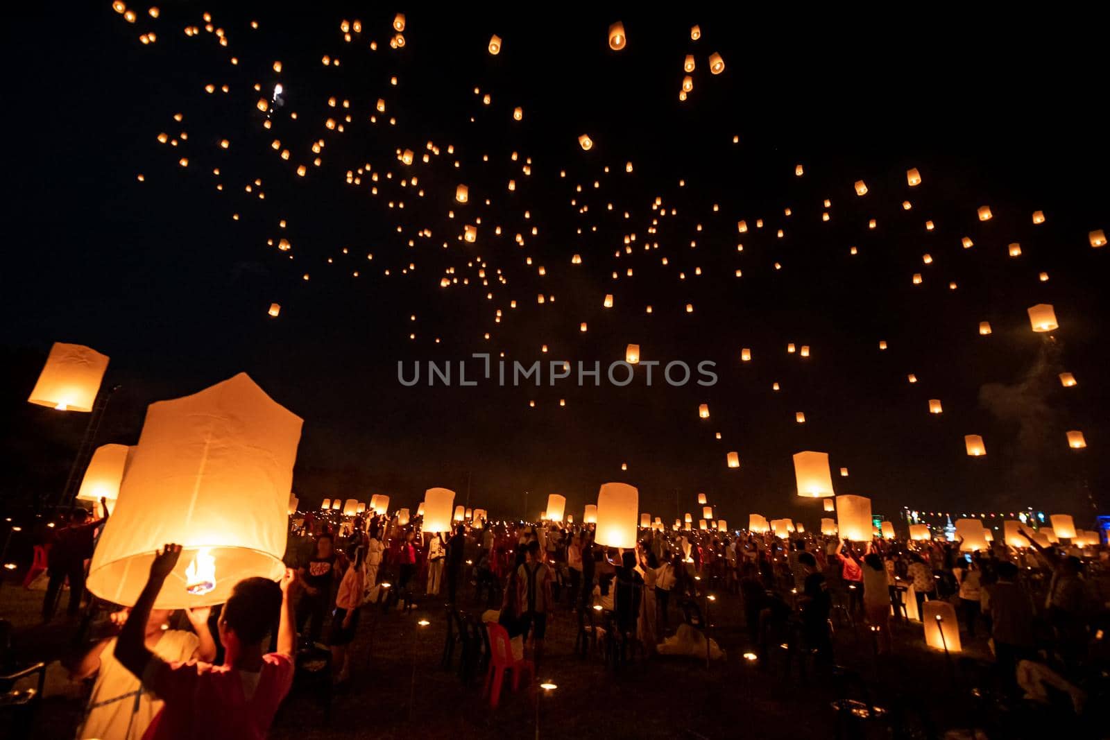 Floating lanterns on sky in Loy Krathong Festival by NuwatPhoto