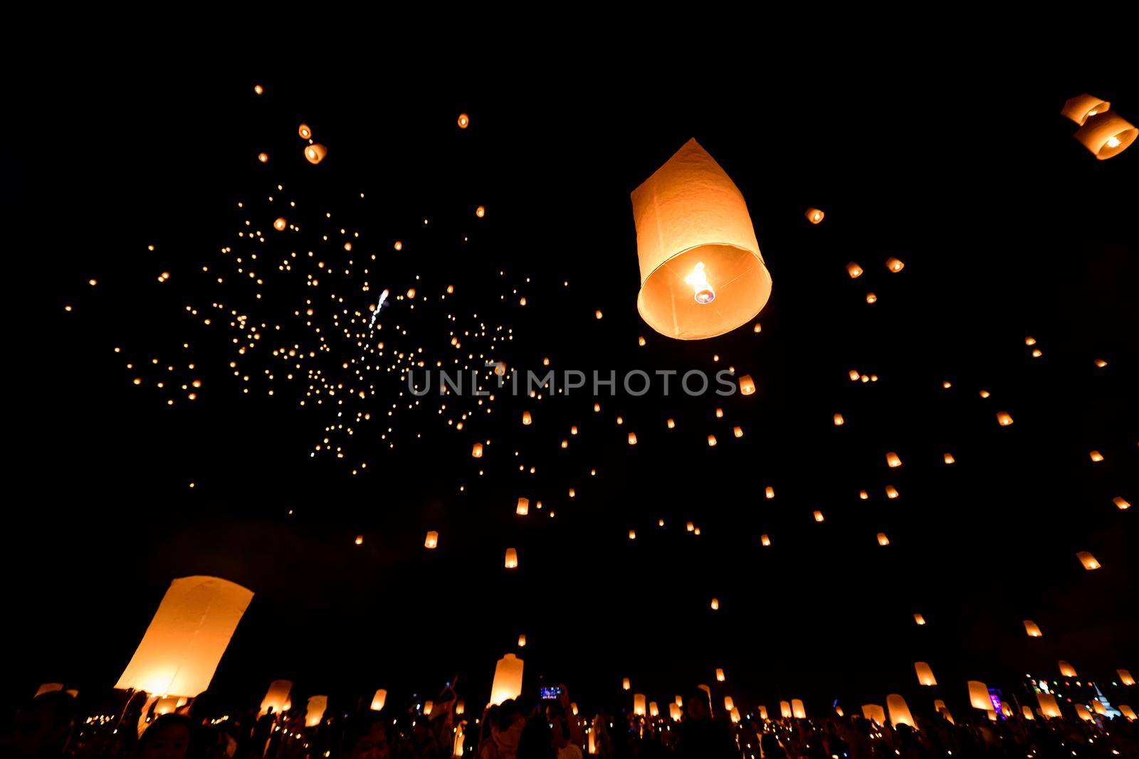 Floating lanterns on sky in Loy Krathong Festival by NuwatPhoto
