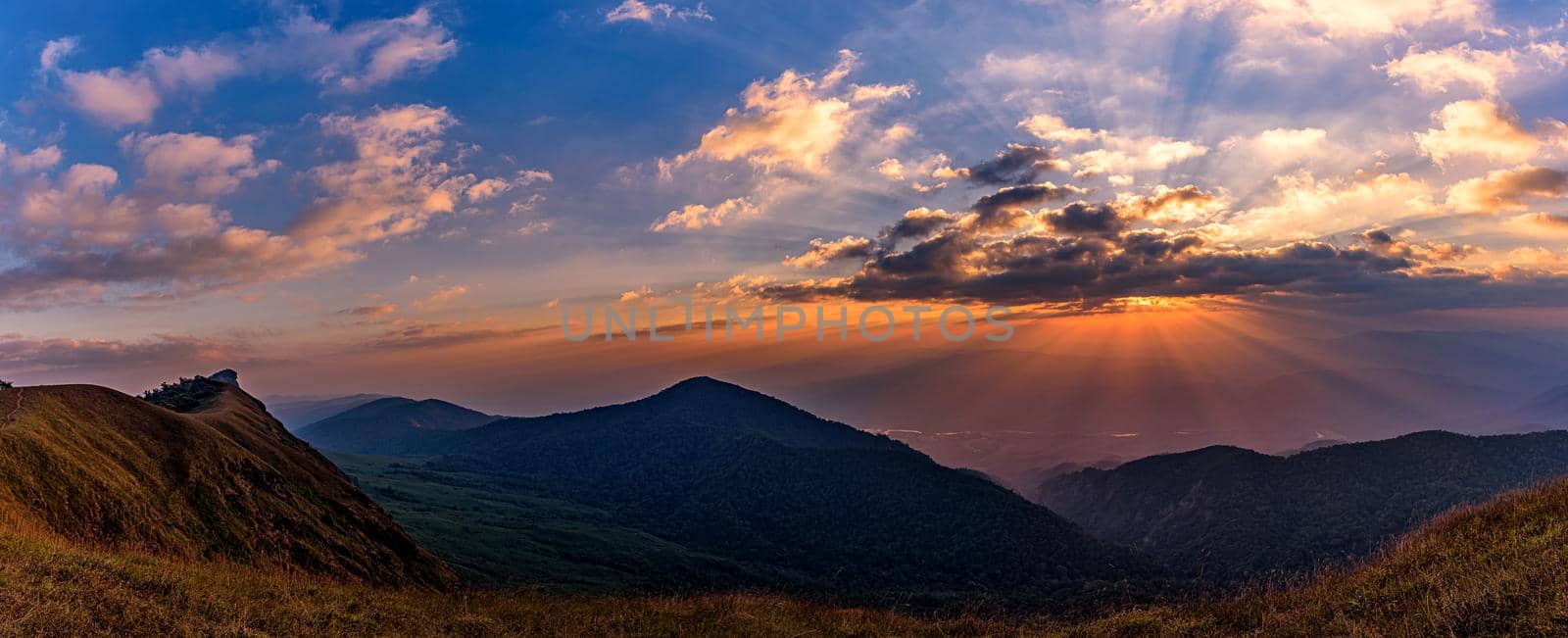 Beautiful sunset in the evening on Mon Chong mount, Chiang Mai, Thailand. by NuwatPhoto