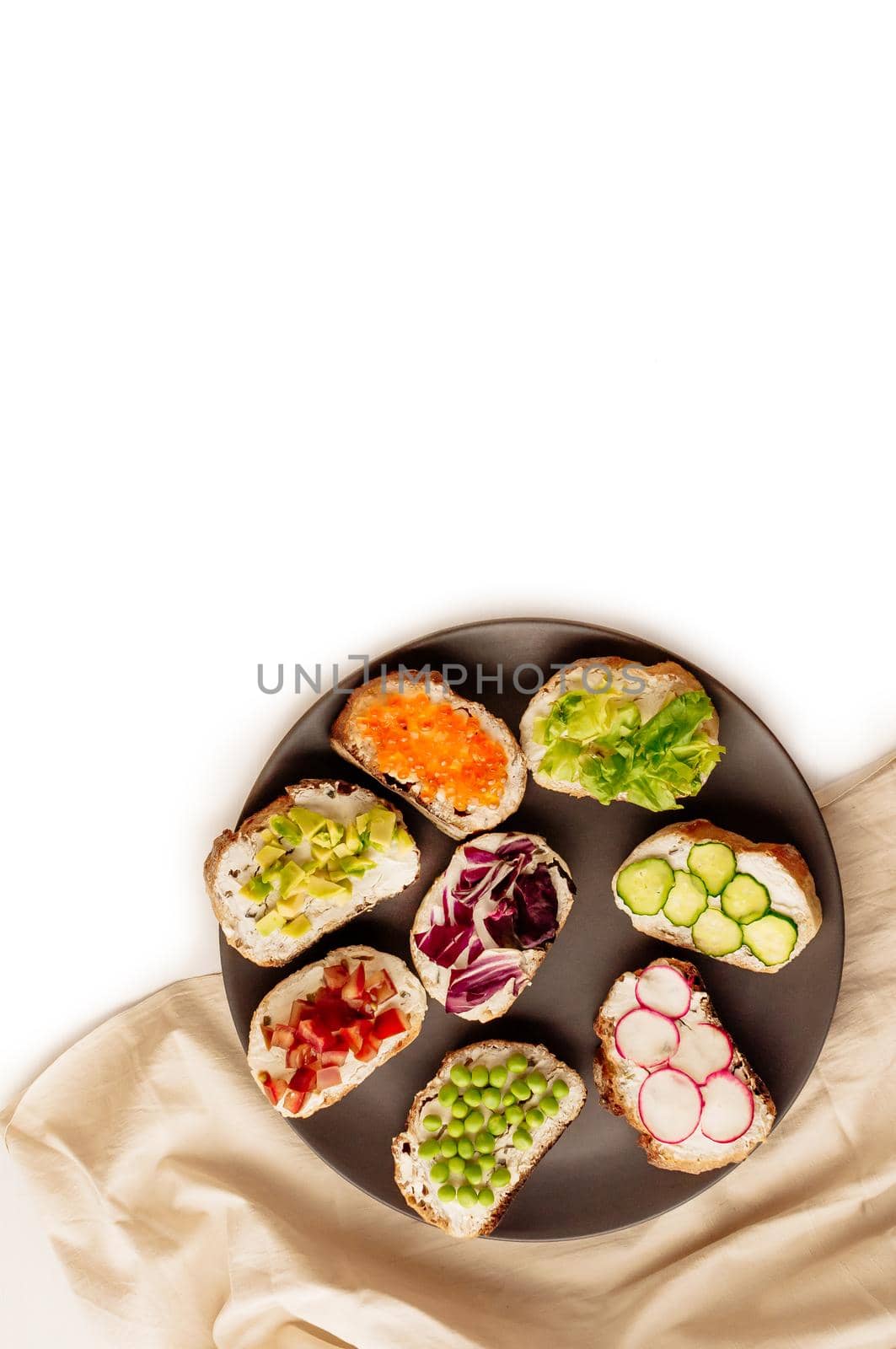 Mini sandwich set with french baguette, cheese, fish and avocado on white background top view mock up.copy space