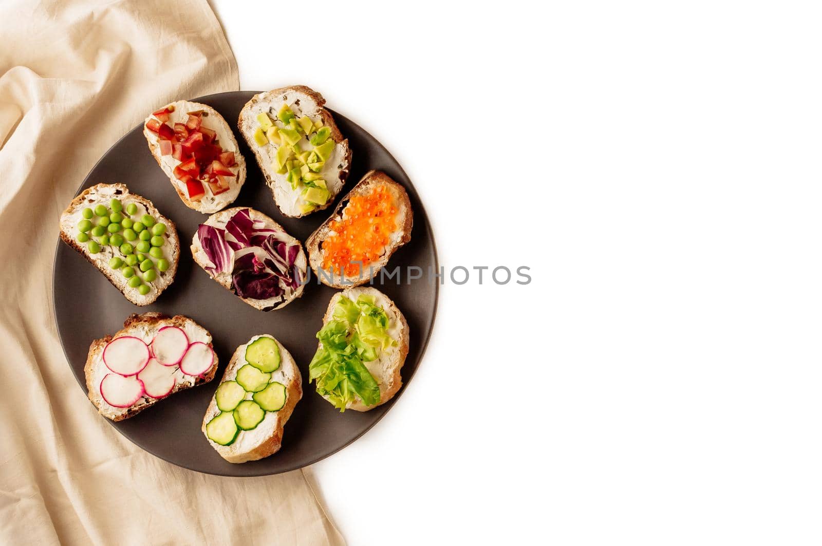 Mini sandwich set with french baguette, cheese, fish and avocado on white background top view mock up.copy space