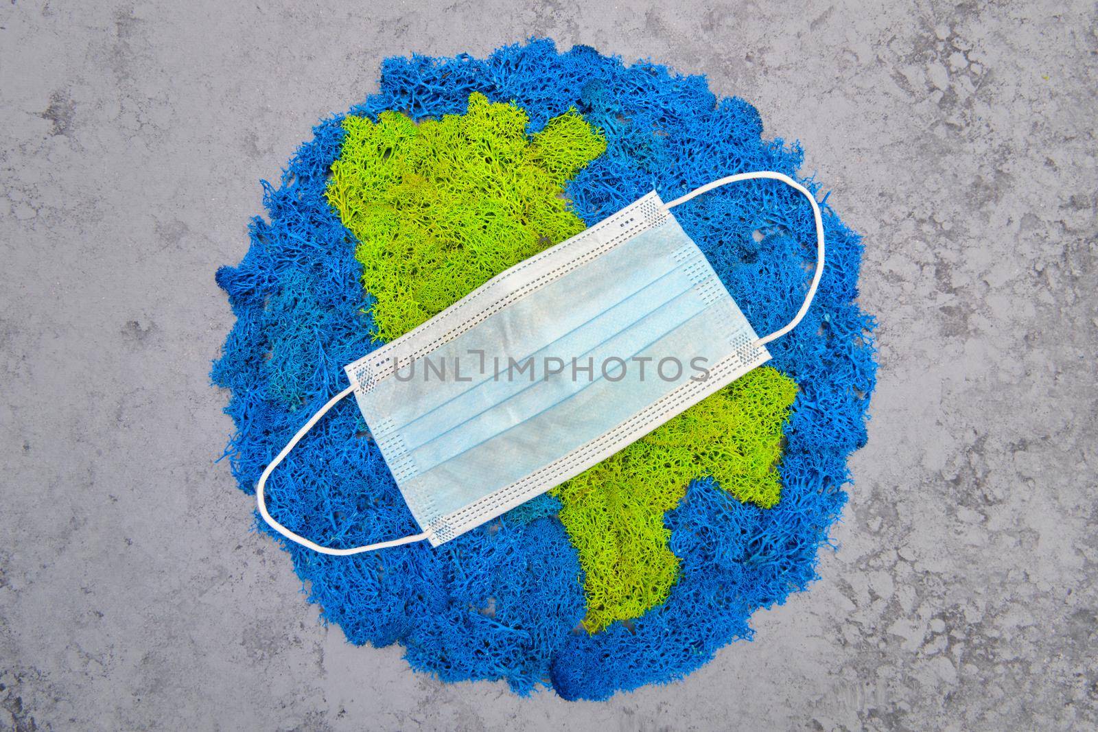 Planet Earth and continents, stabilized painted moss, gray background, medical m