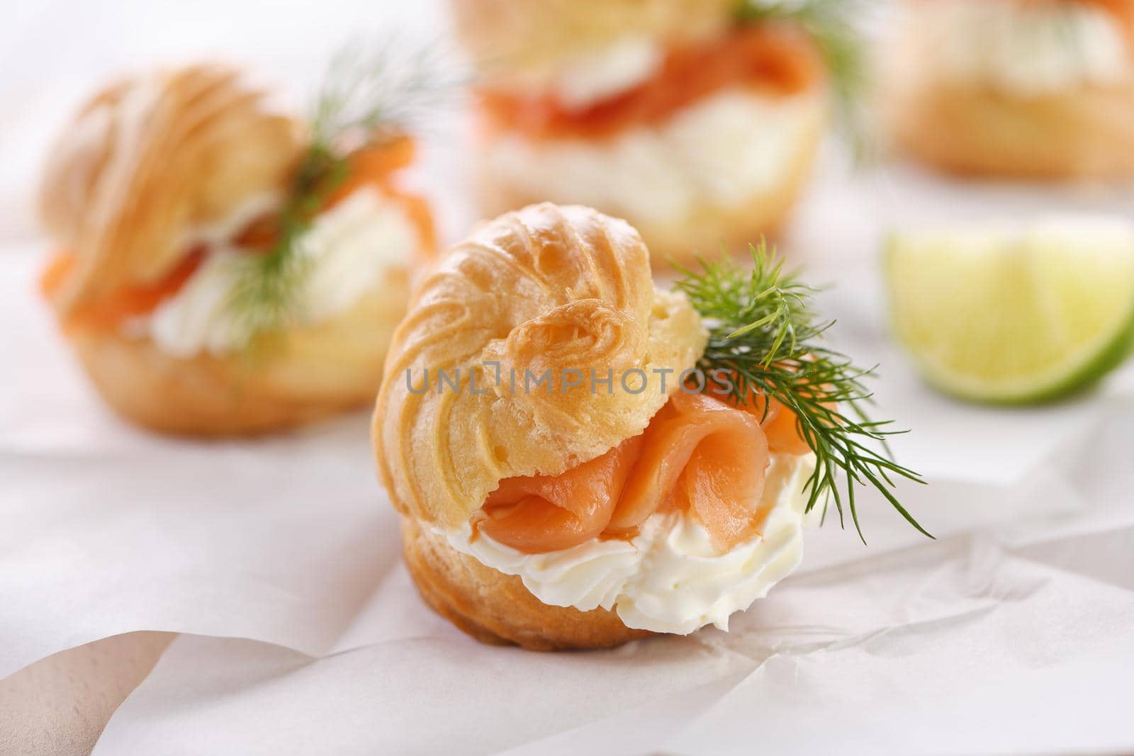 Profiteroles stuffed with cream cheese and salmon.
