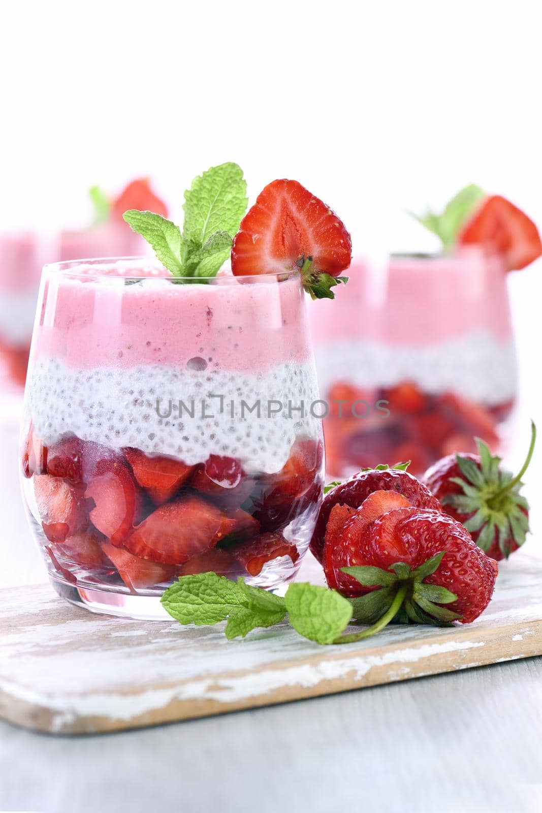 Strawberry dessert with milk vanilla chia and fresh strawberry pieces