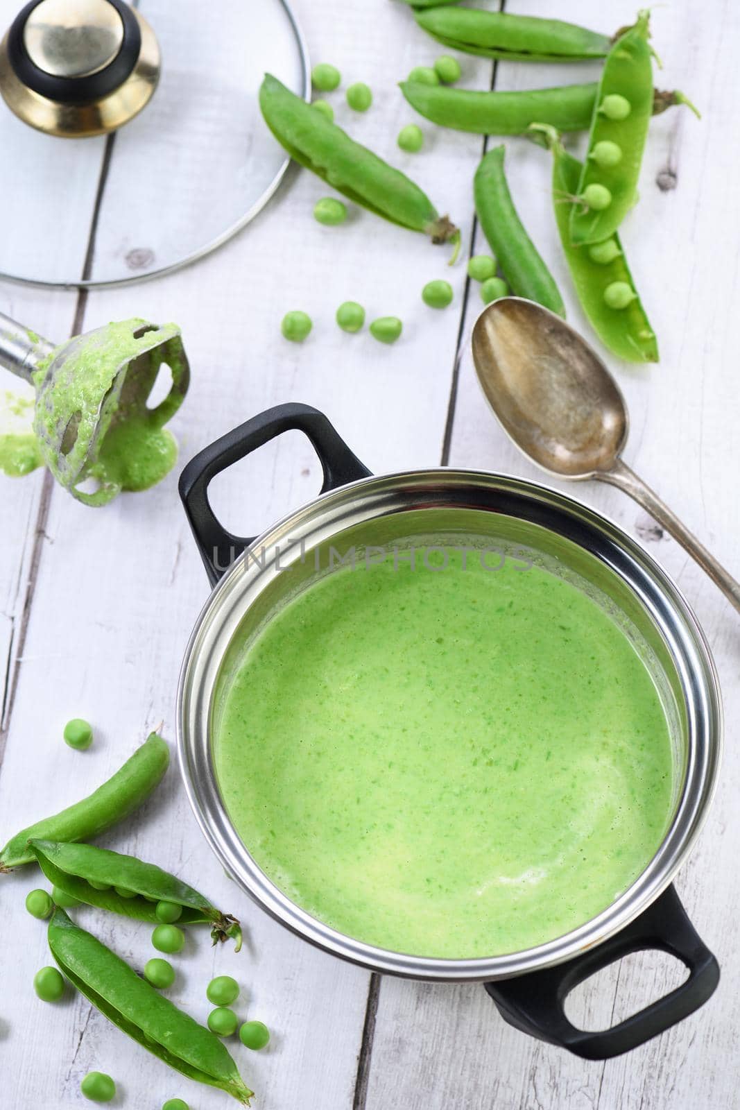 Saucepan with mashed pea soup by Apolonia