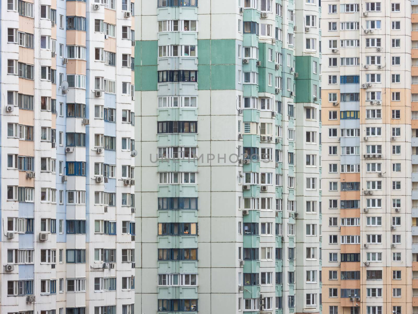 Fragment of the facade of high-rise residential buildings. Urban stone jungle
