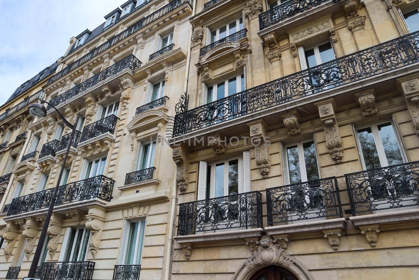 Architecture of Paris France. Facades of a traditional apartment buildings