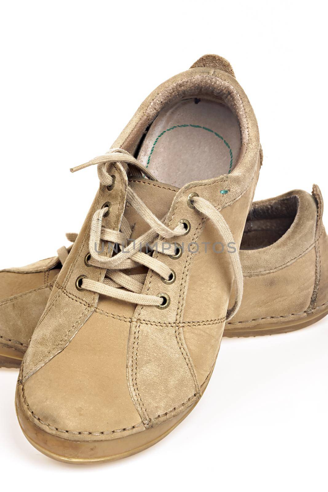 Casual brown shoes on white background. Urban fashion.