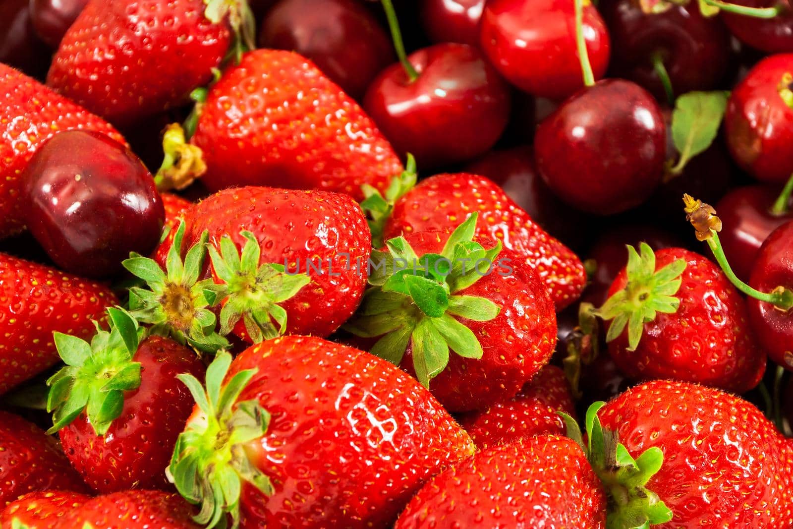 Closeup of fresh strawberries and cherries