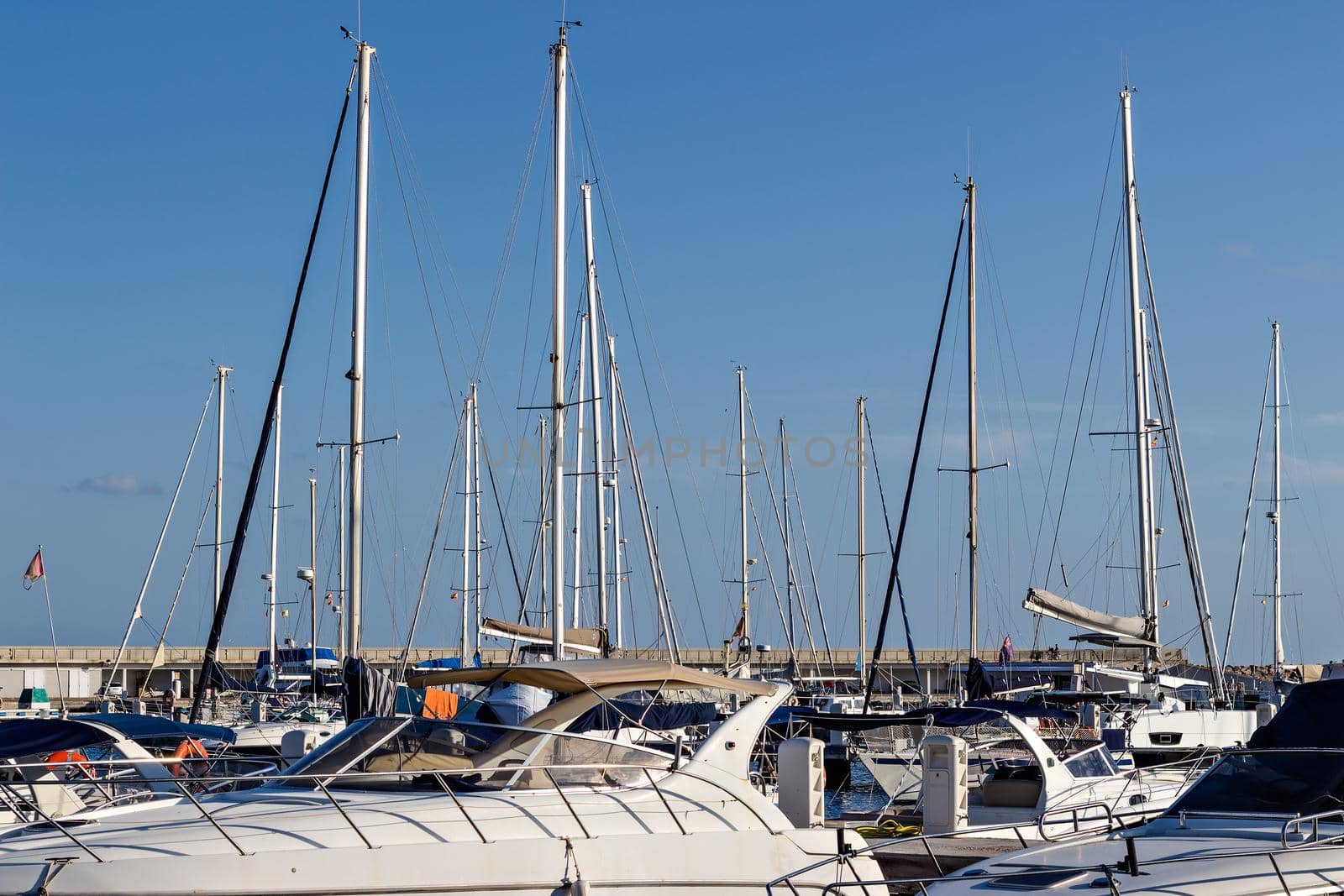 Several boats waiting in the marina.