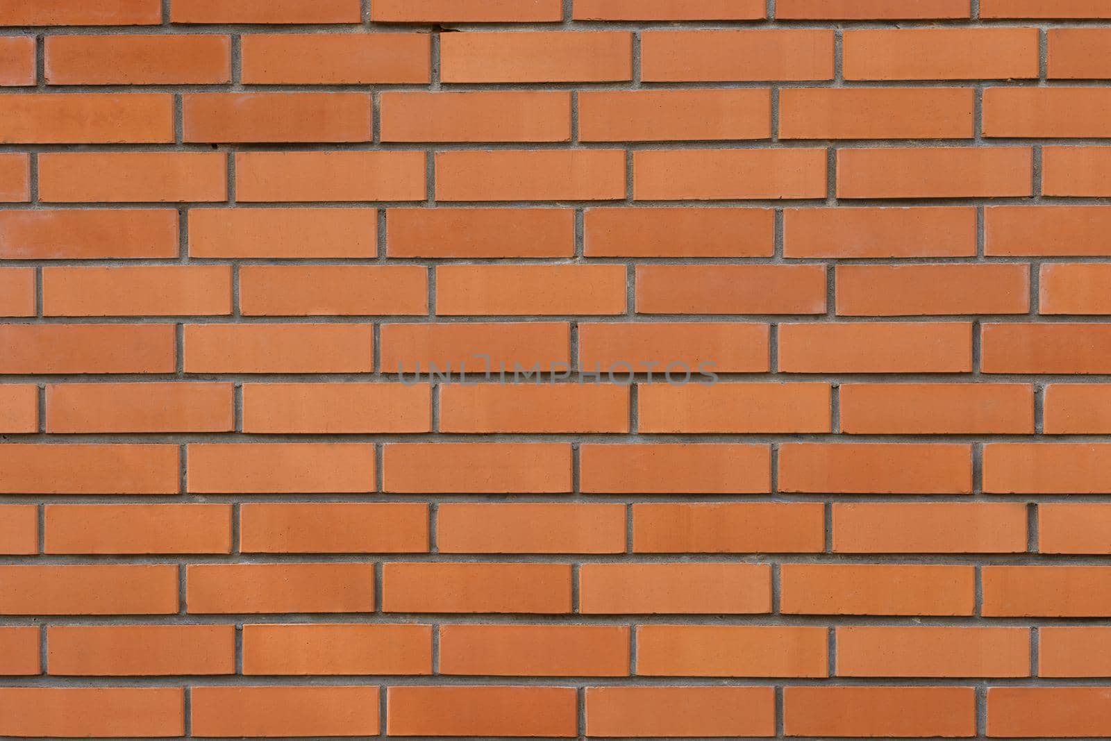 Orange brick wall surface. Brick wall backdrop with space for text