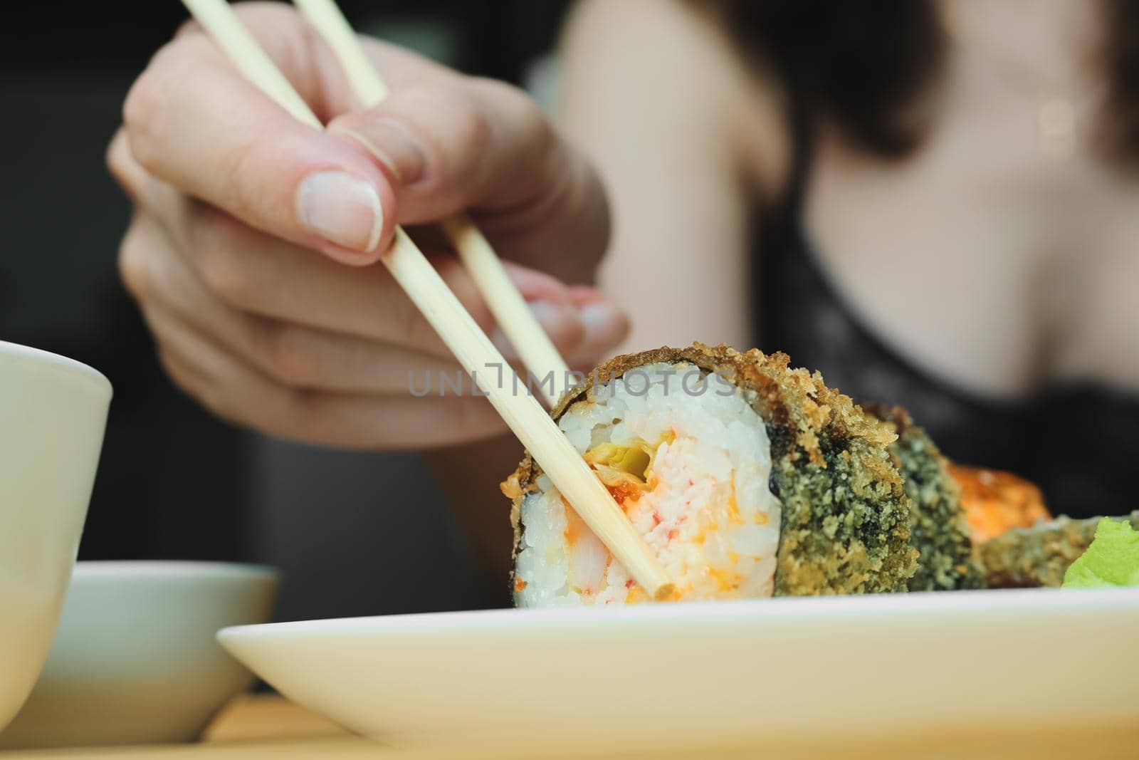 Japanese kitchen. Set of Japanese sushi and rolls. Food sticks.