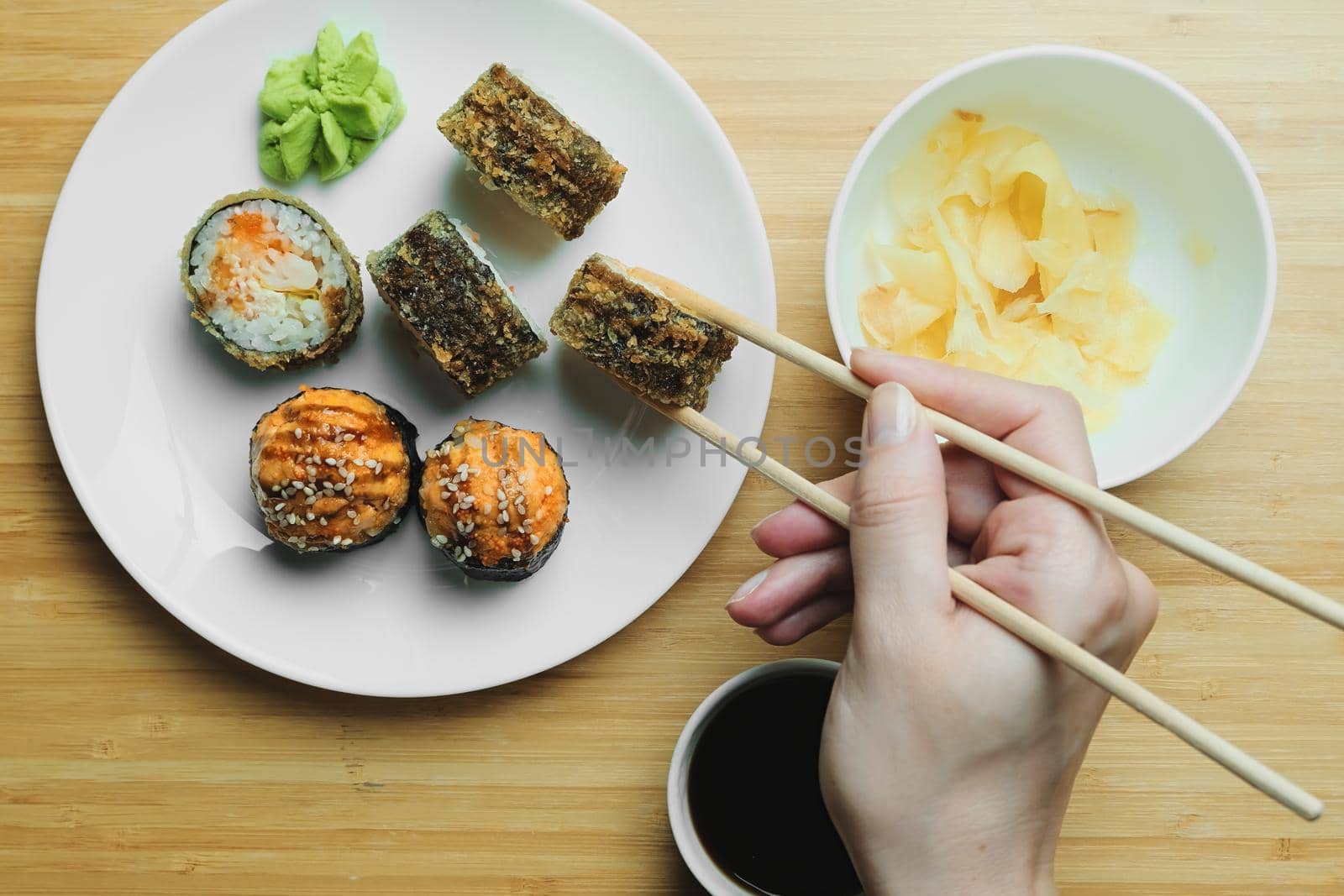 Japanese kitchen. Set of Japanese sushi and rolls. Food sticks.