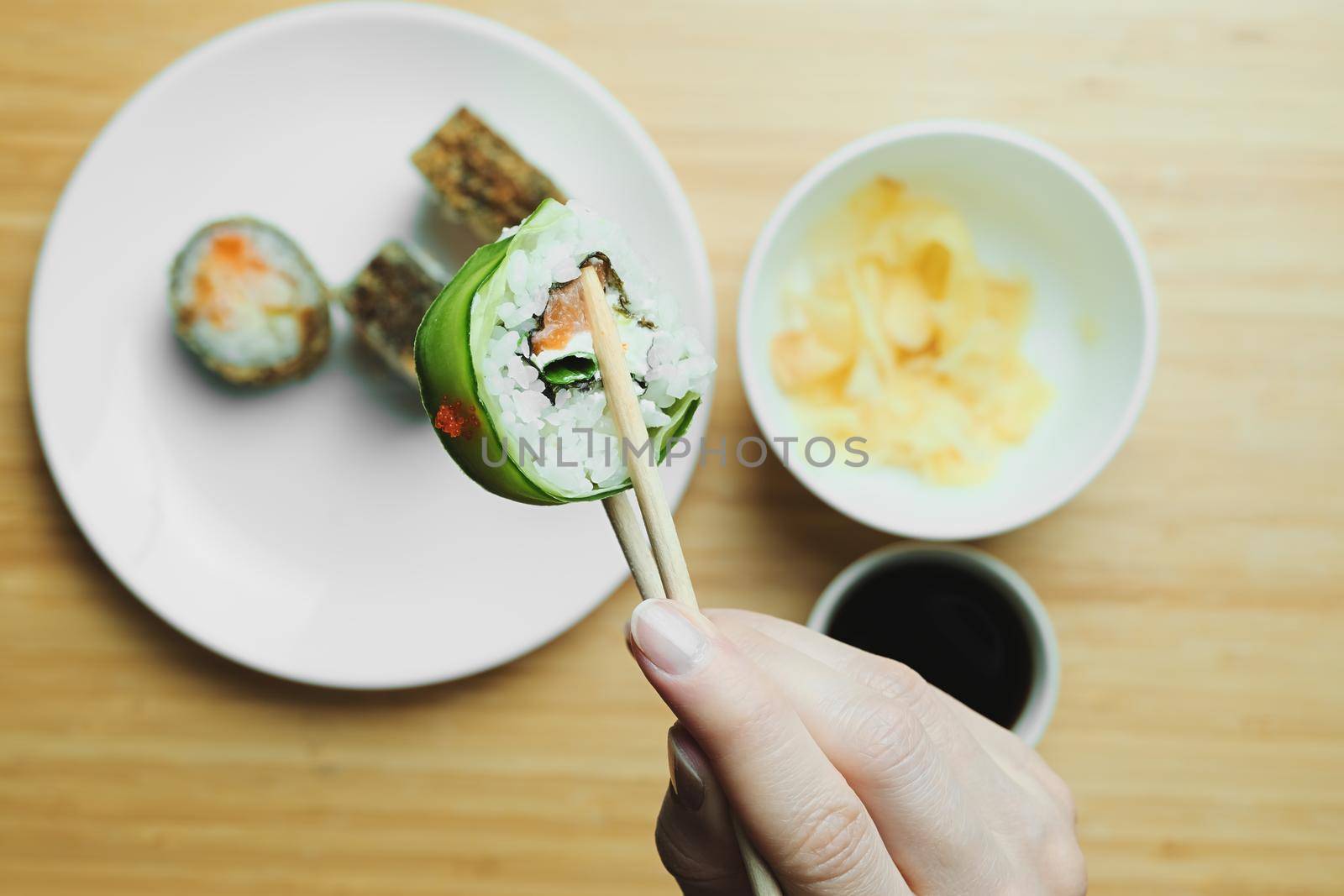 Japanese kitchen. Set of Japanese sushi and rolls. Food sticks. by vollirikan