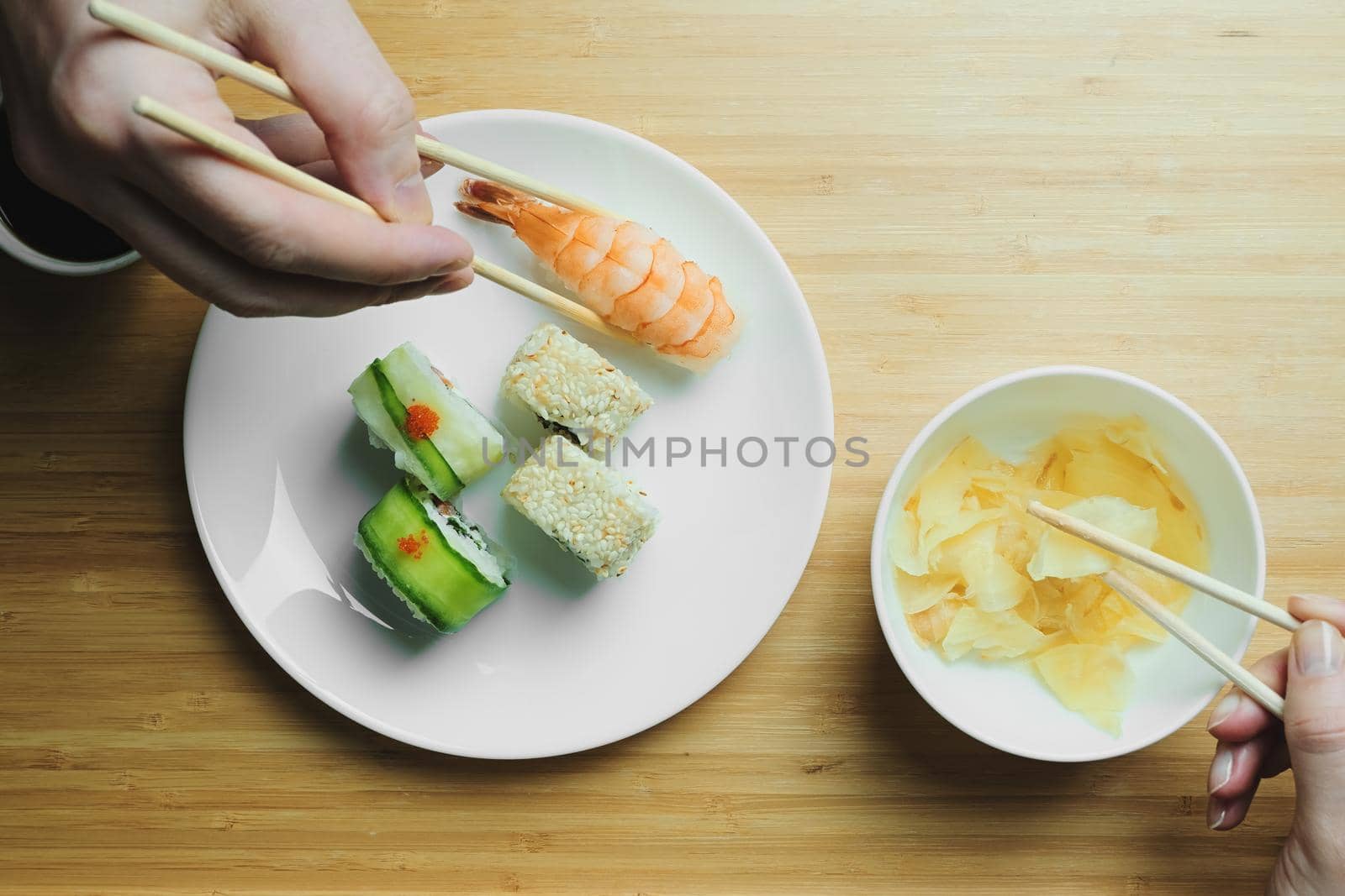 Japanese kitchen. Set of Japanese sushi and rolls. Food sticks.