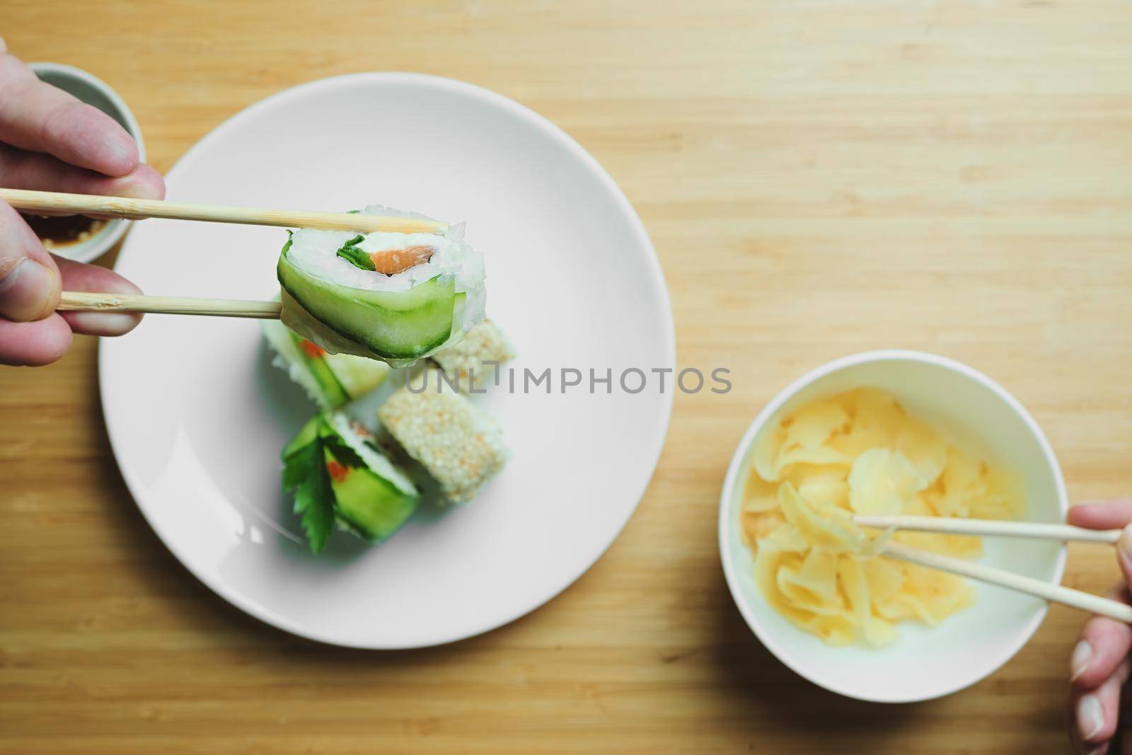 Japanese kitchen. Set of Japanese sushi and rolls. Food sticks. by vollirikan
