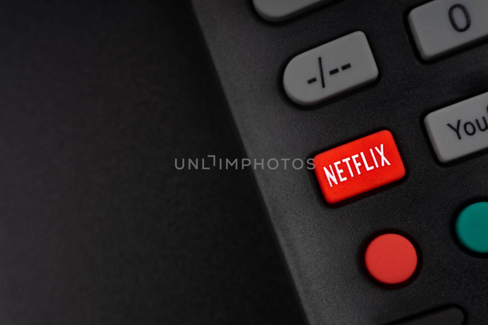 NETFLIX television remote controller on black background by silverwings
