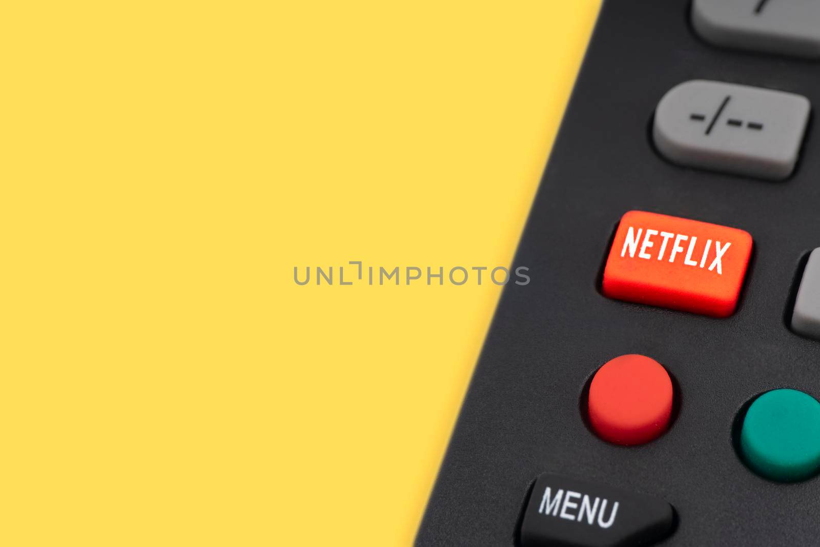 Kuala Lumpur, Malaysia : May 1, 2021 : NETFLIX television remote controller on yellow background