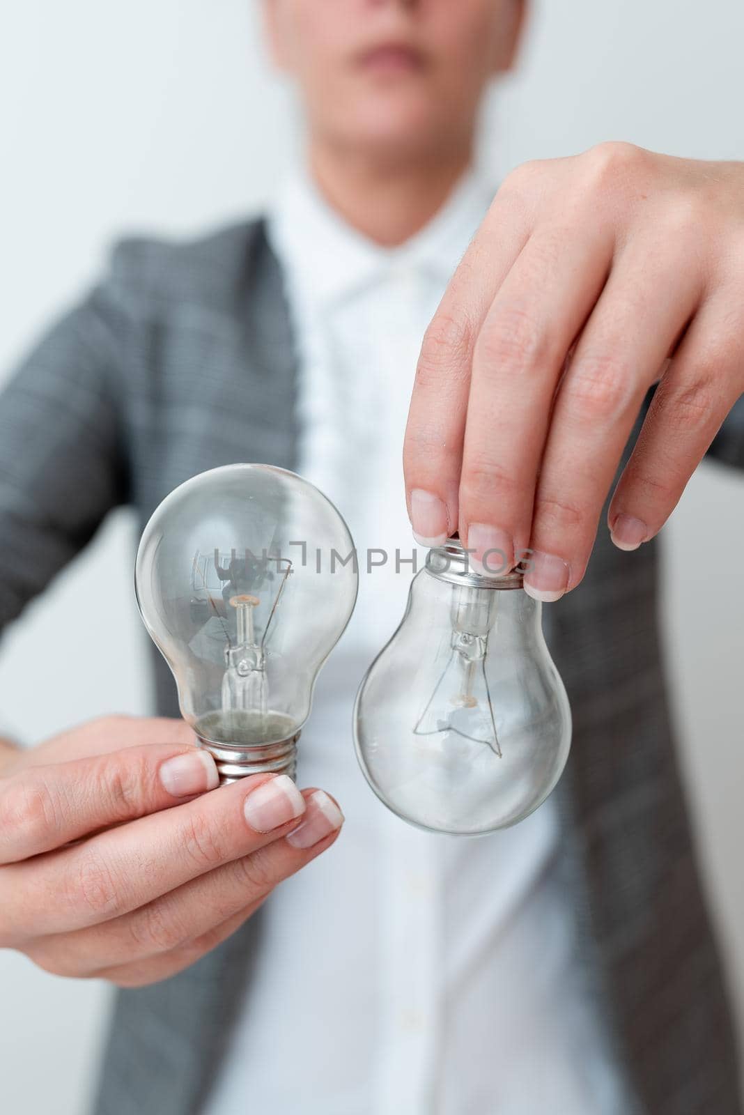 Lady Holding Two Lamps Upside Down With Outfit Proposing New Ideas For Project, Business Woman Carry 2 Bulbs Opposite Displaying New Technologies, Two Vise Versa Lamps Exhibiting Fresh Idea by nialowwa