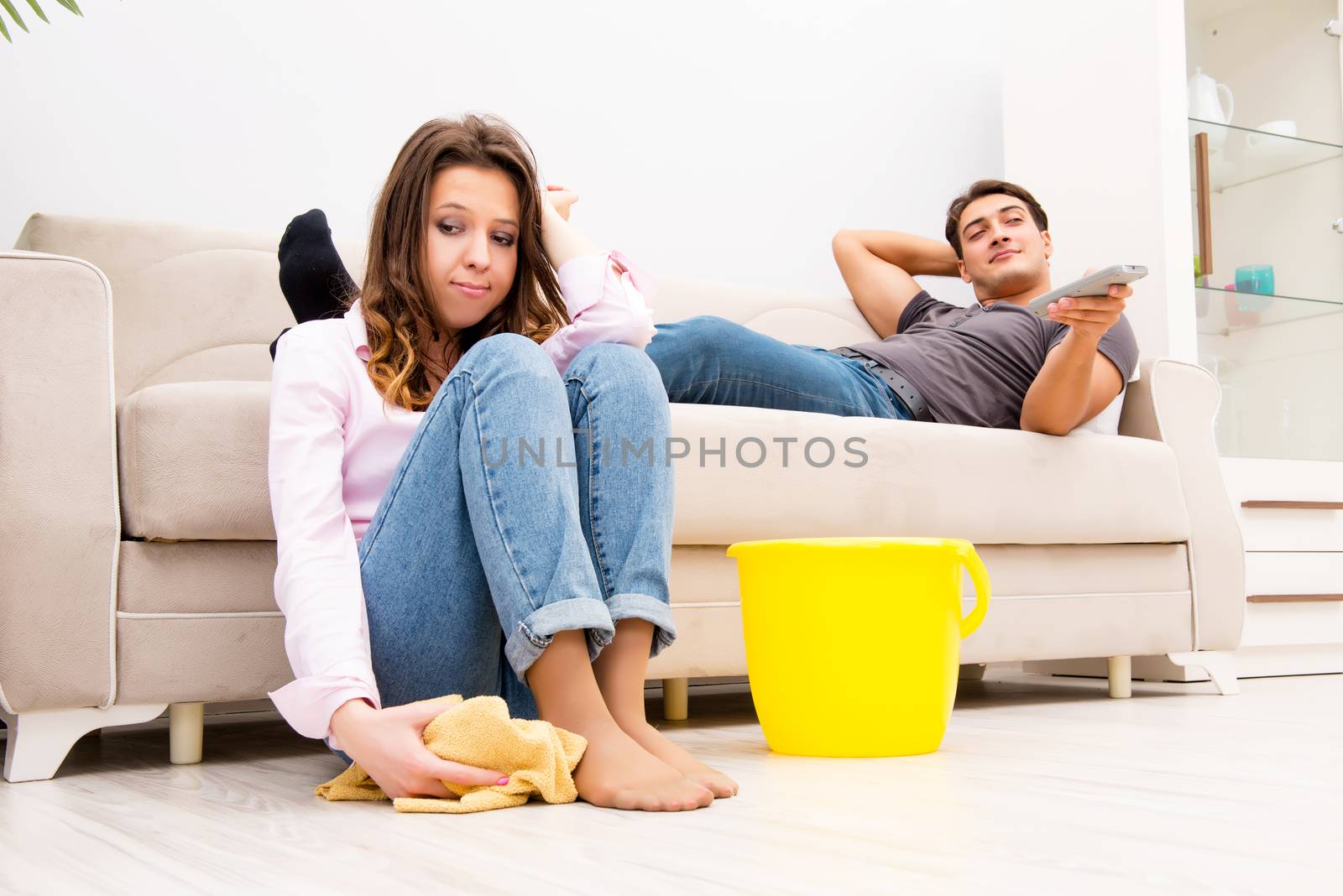 House floor cleaning concept with wife and husband