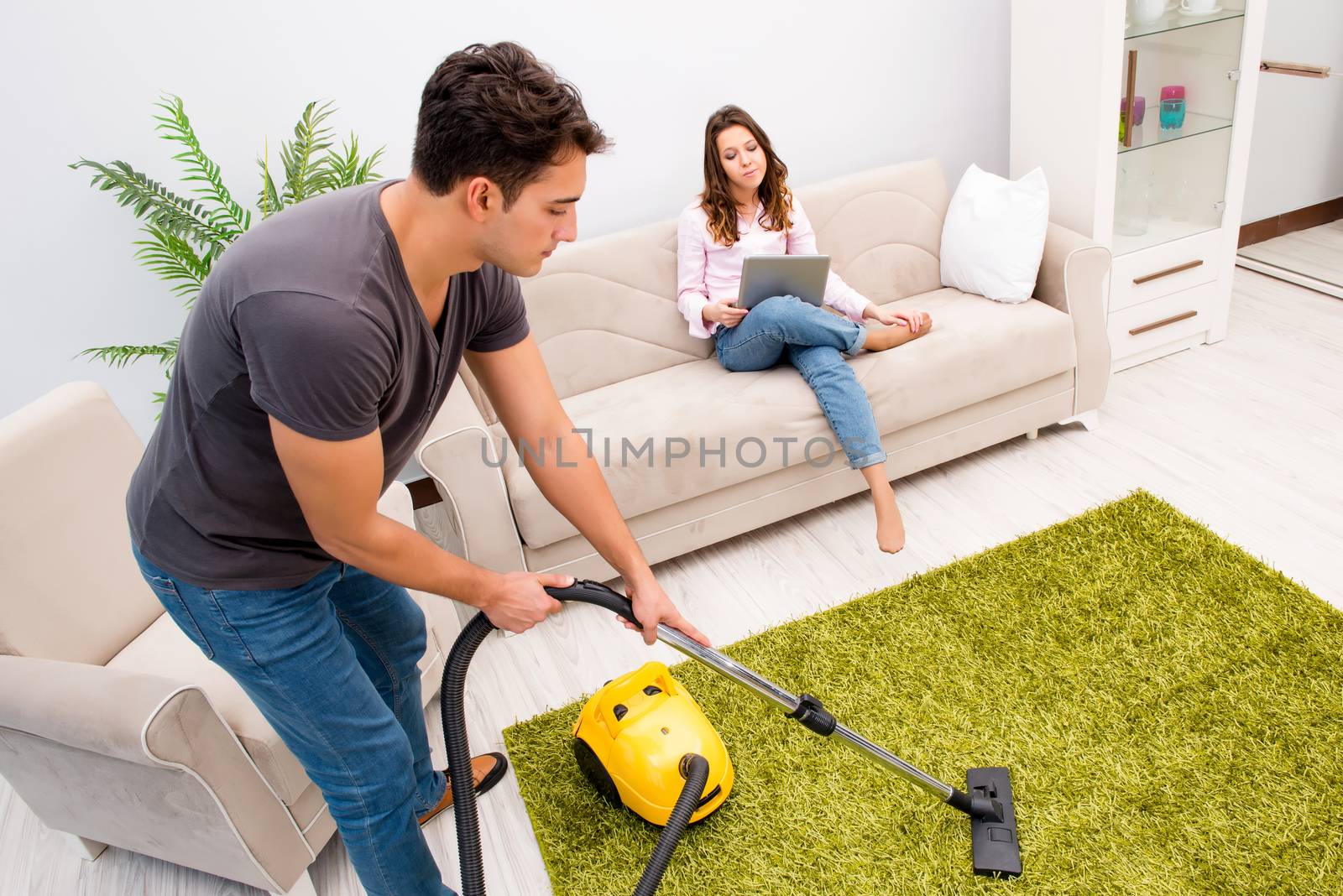 Cleaning the house with vacuum cleaner