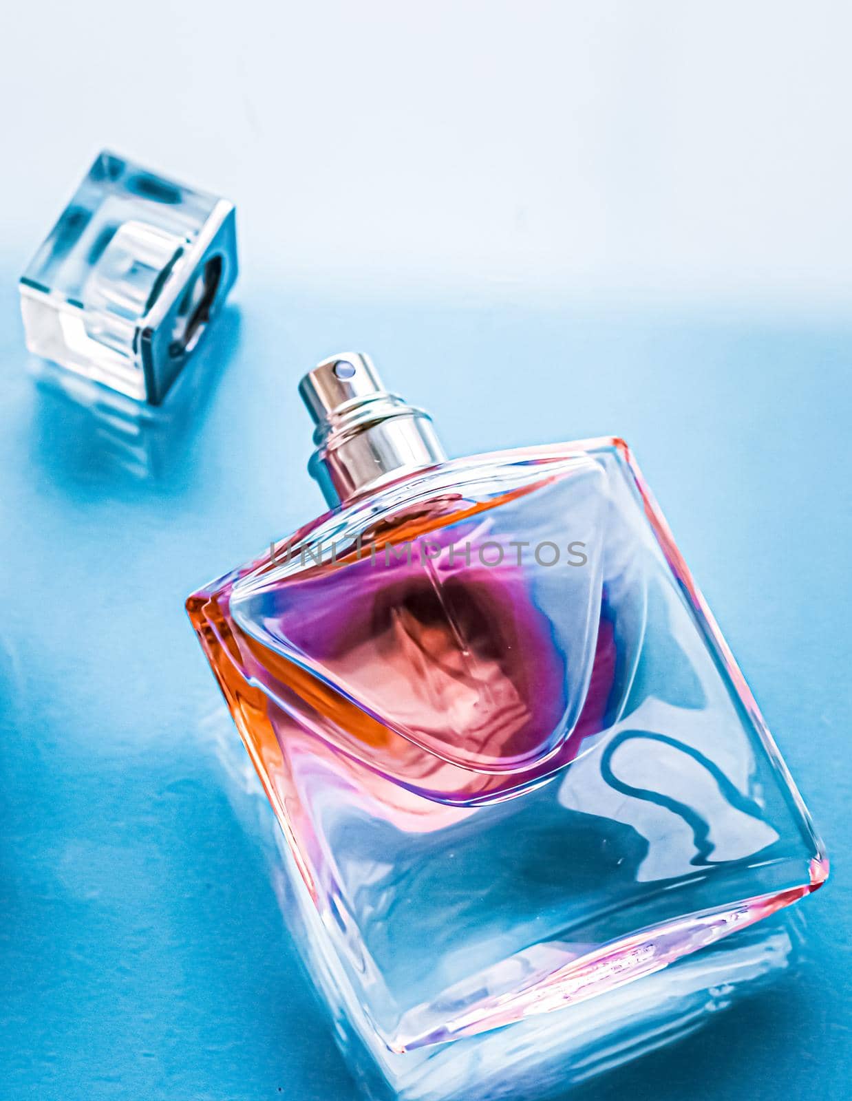 Perfume bottle on glossy background, sweet floral scent, glamour fragrance and eau de parfum as holiday gift and luxury beauty cosmetics brand design.