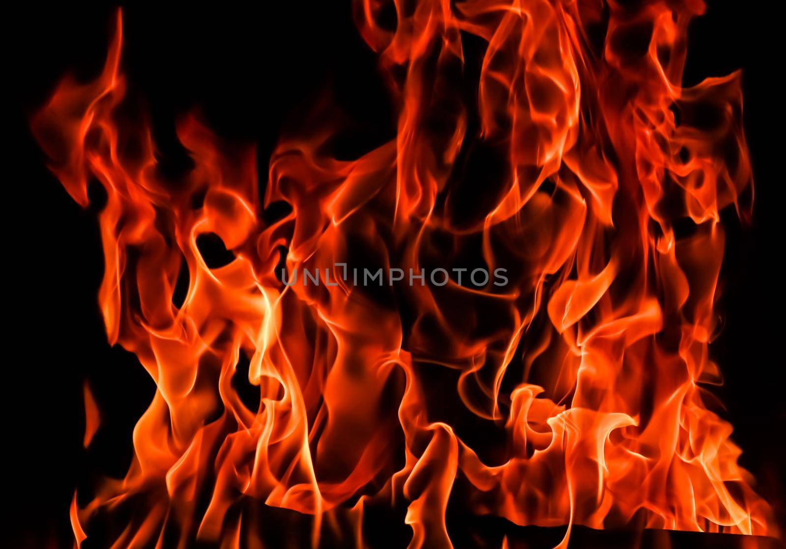 Flames of fire on a black background. The mystery of fire. by Olayola
