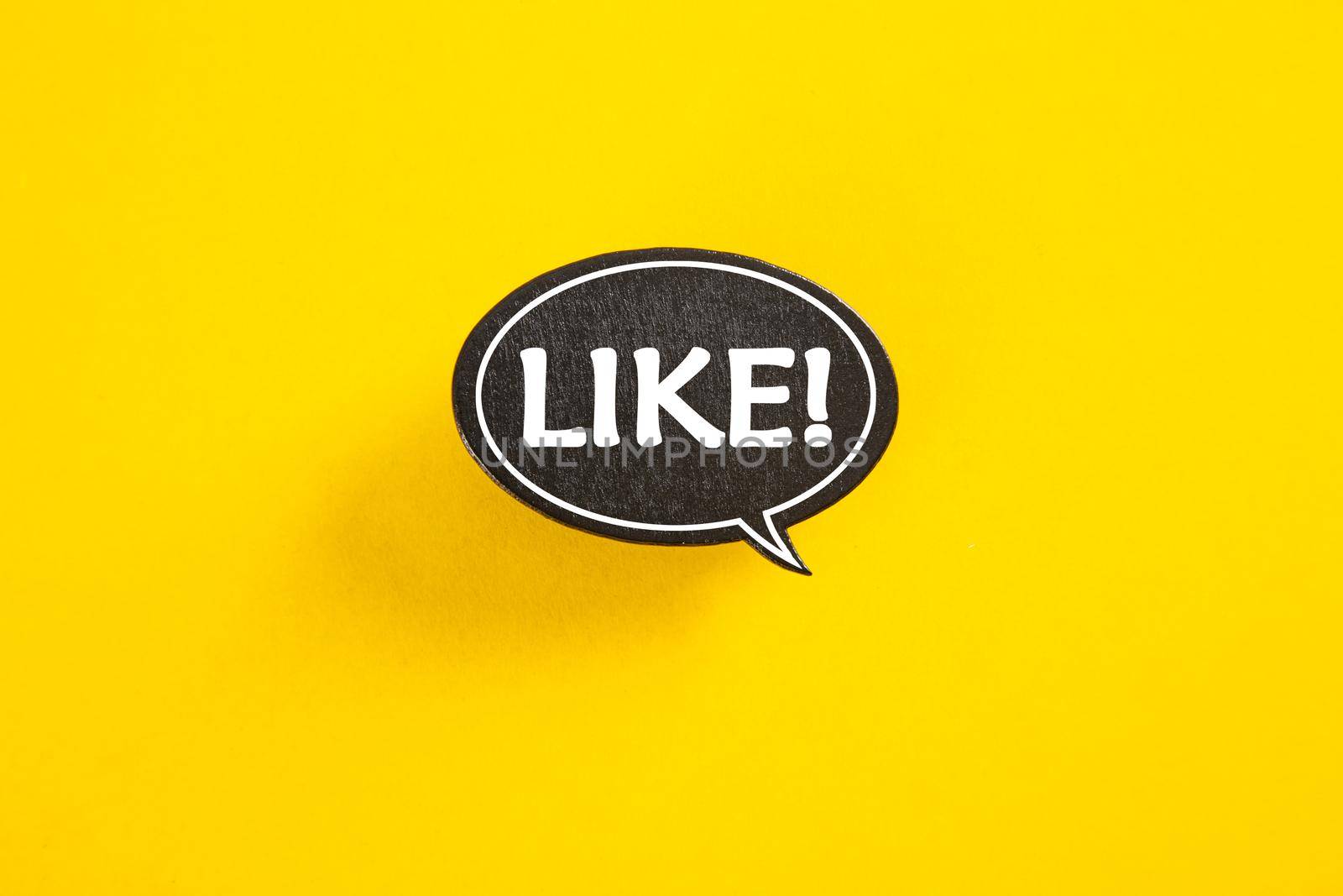 Like speech bubble isolated on yellow paper background with drop shadow.