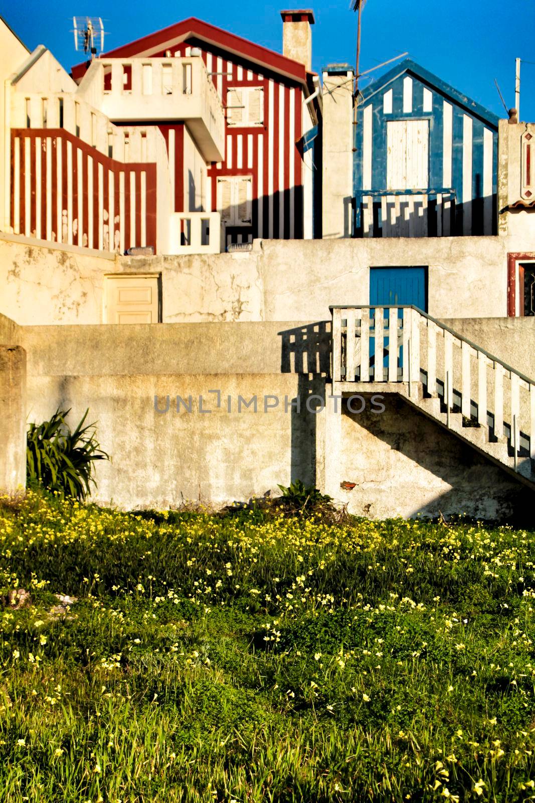 Beautiful and colorful striped facades in Costa Nova beach in Aveiro, Porto, Portugal.