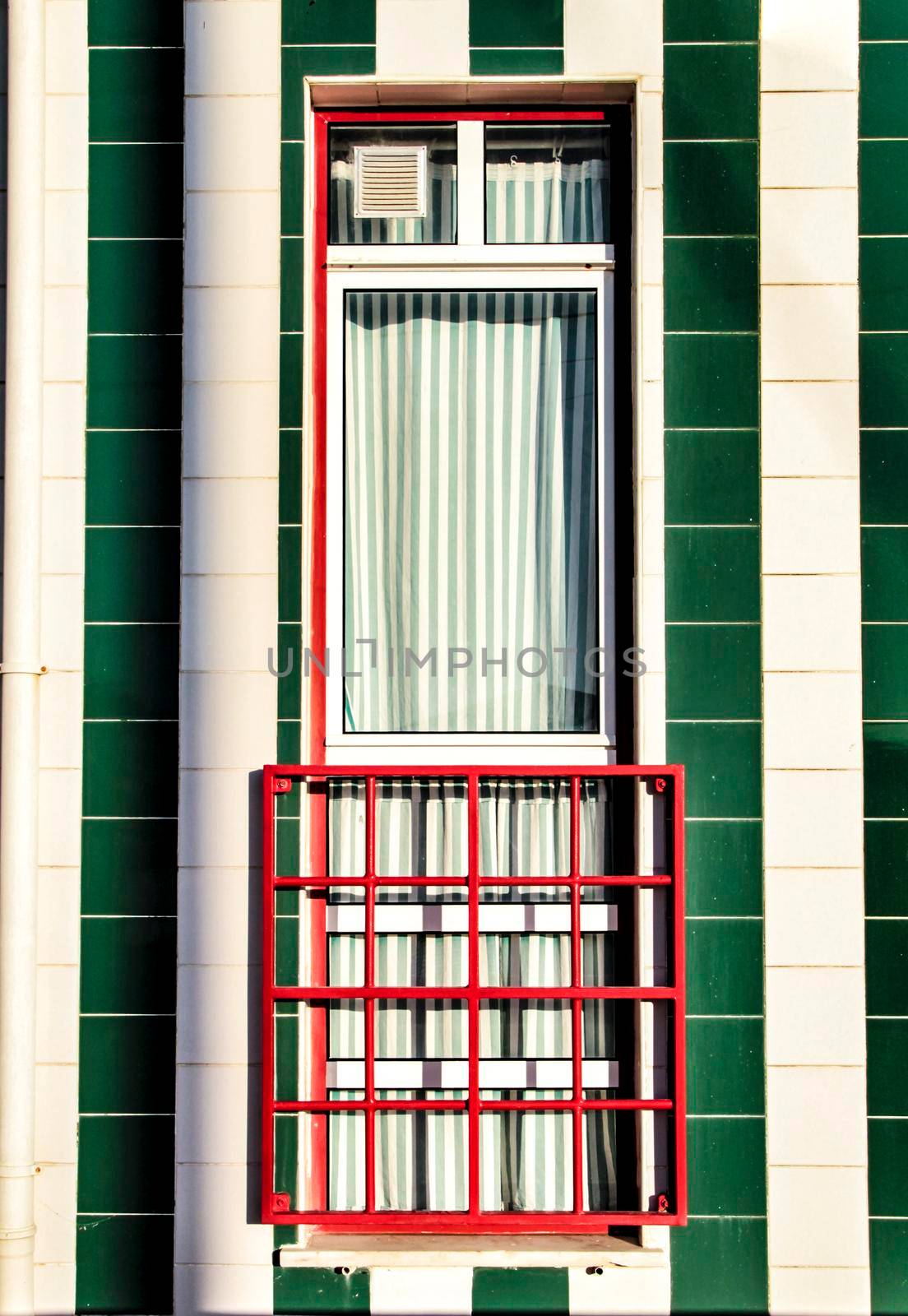 Beautiful and colorful striped facades in Costa Nova beach in Aveiro, Porto, Portugal.