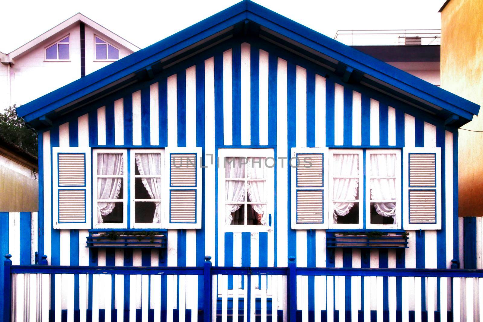 Beautiful and colorful striped facades in Costa Nova beach in Aveiro, Porto, Portugal.
