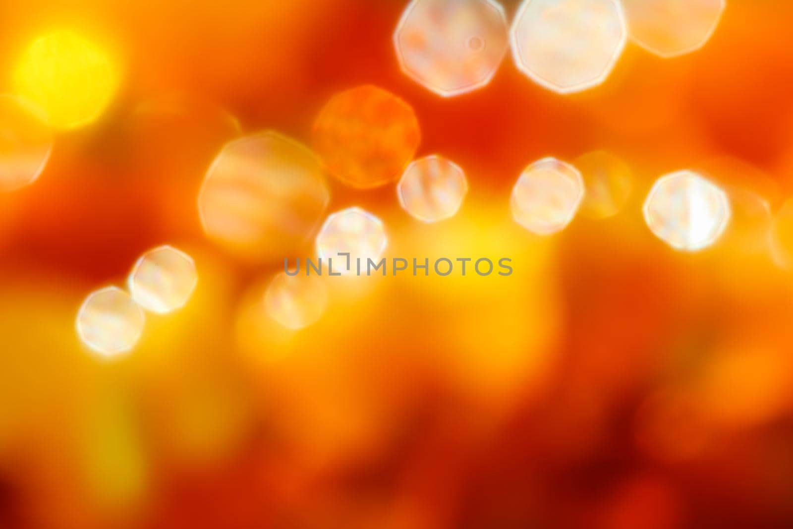 Bright colors amber, sunny light shining background, blurred the light of the bokeh shines by Olayola