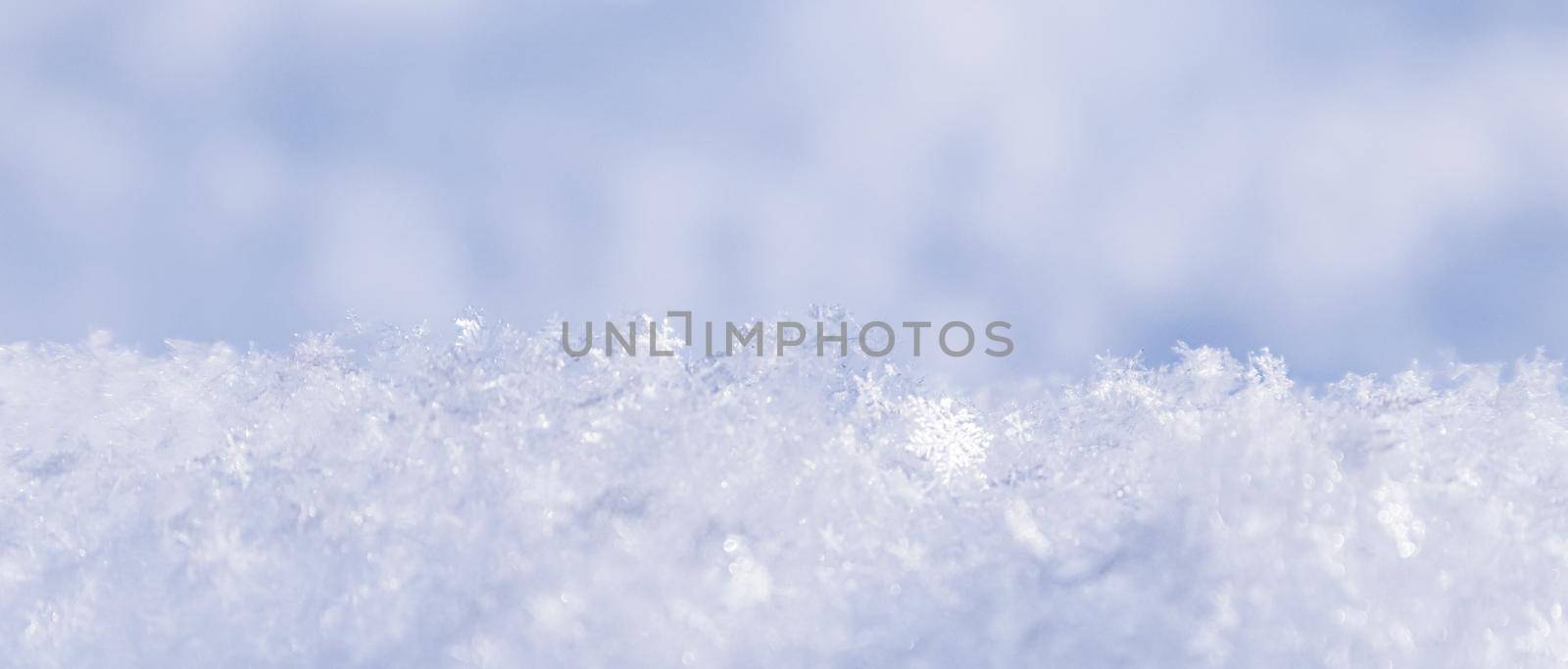 Background of fresh snow. Natural winter background. Snow texture in blue tone by Olayola