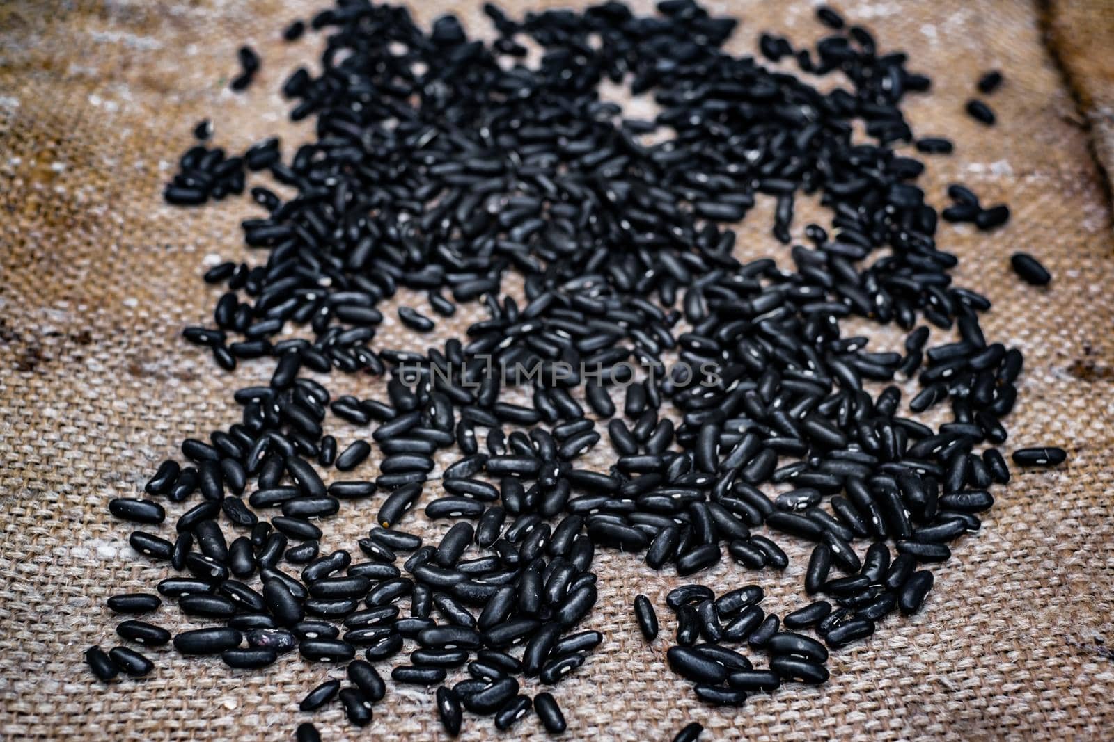 black bean seeds on jute bag