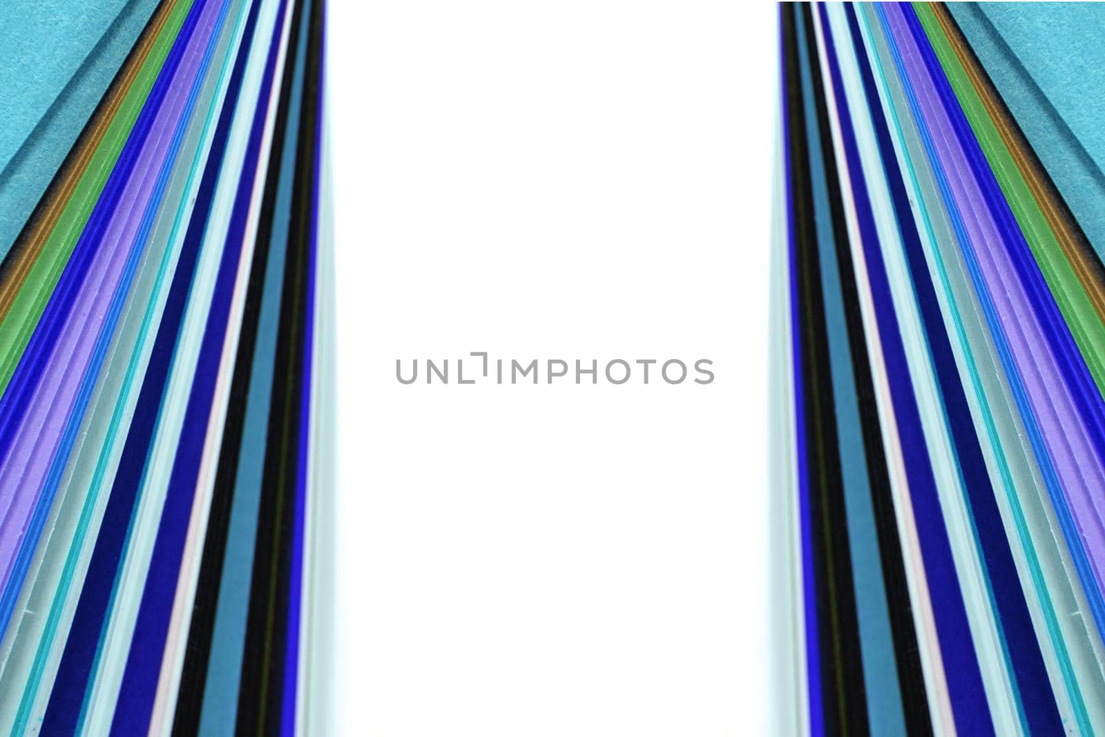 Sheets of colored paper on white background by Roberto